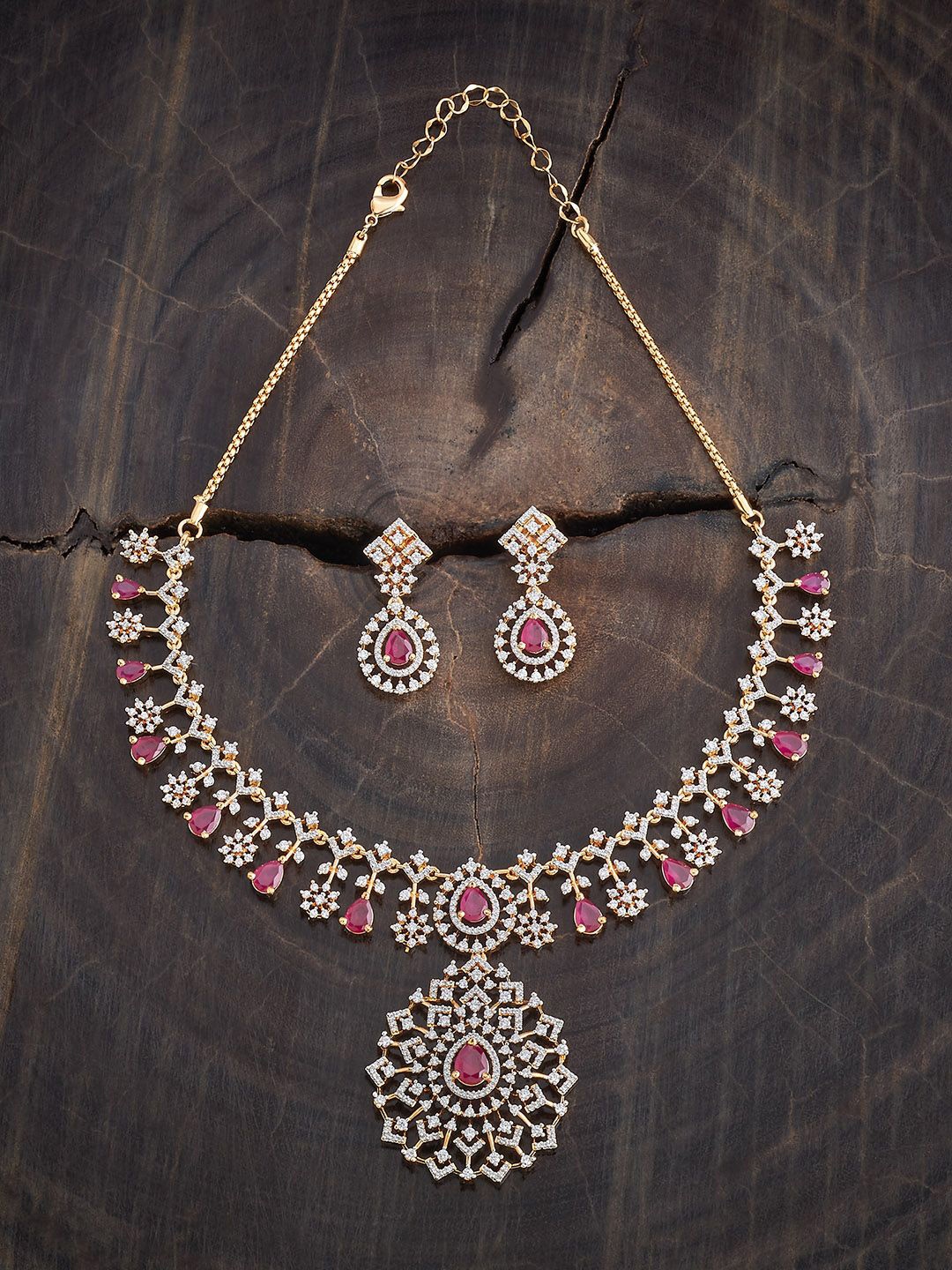 Kushal's Fashion Jewellery Gold-Plated Ruby Stone Studded & Zircon NeckJewellery Setace
Kushal's Fashion Jewellery Gold-Plated Ruby Stone Studded & Zircon NeckJewellery Setace