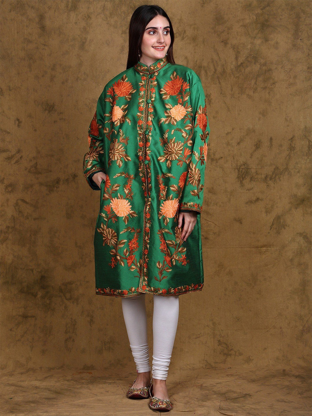 Exotic India Green Art Silk Kashmiri Long Jacket with Aari Embroidered Giant Floral Vine
Exotic India Green Art Silk Kashmiri Long Jacket with Aari Embroidered Giant Floral Vine