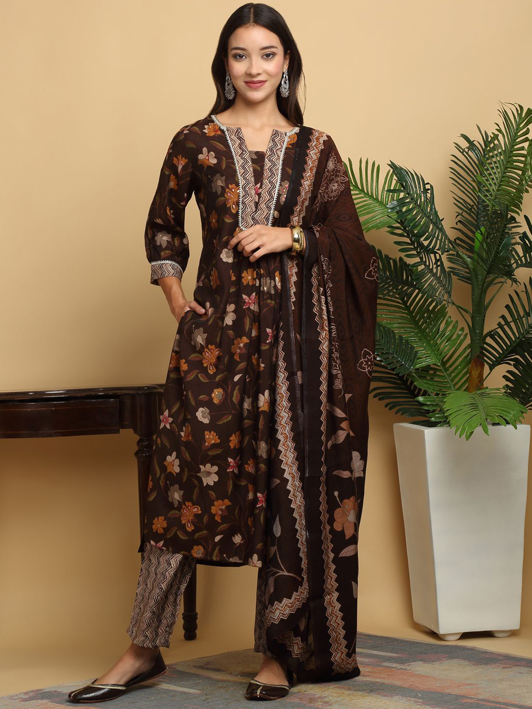 KALINI Floral Printed Gotta Patti Chanderi Silk Straight Kurta with Trousers & Dupatta, Brown
KALINI Floral Printed Gotta Patti Chanderi Silk Straight Kurta with Trousers & Dupatta, Brown