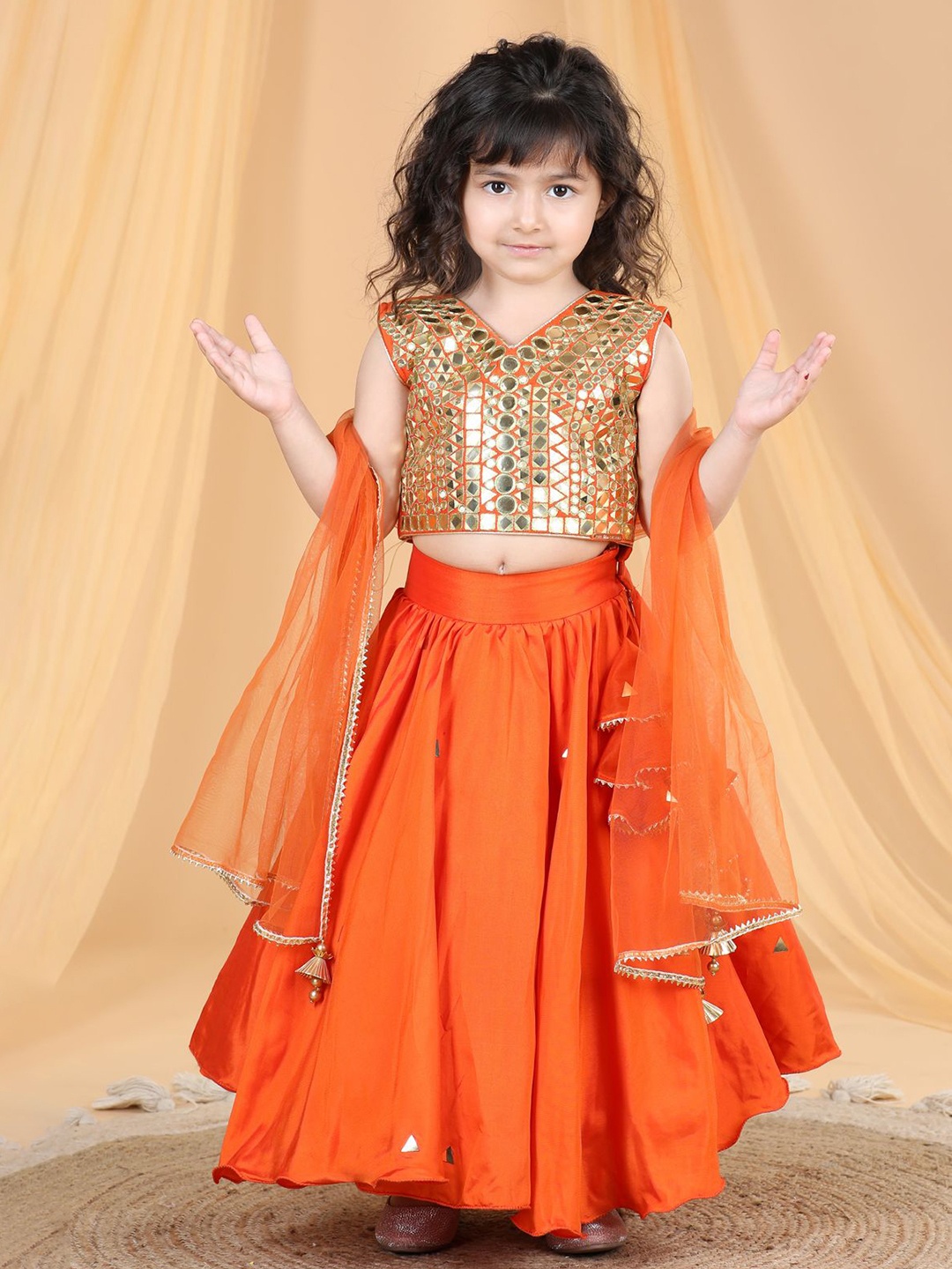 THE LITTLE CELEBS Girls Embellished Mirror Work Ready to Wear Lehenga & Blouse With Dupatta, Orange
THE LITTLE CELEBS Girls Embellished Mirror Work Ready to Wear Lehenga & Blouse With Dupatta, Orange