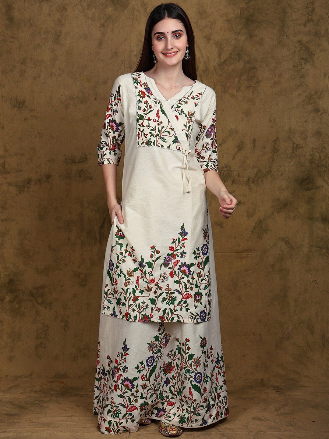Exotic India Whisper White Floral Printed Angrakha Style Straight Kurta and Skirt Set
Exotic India Whisper White Floral Printed Angrakha Style Straight Kurta and Skirt Set
