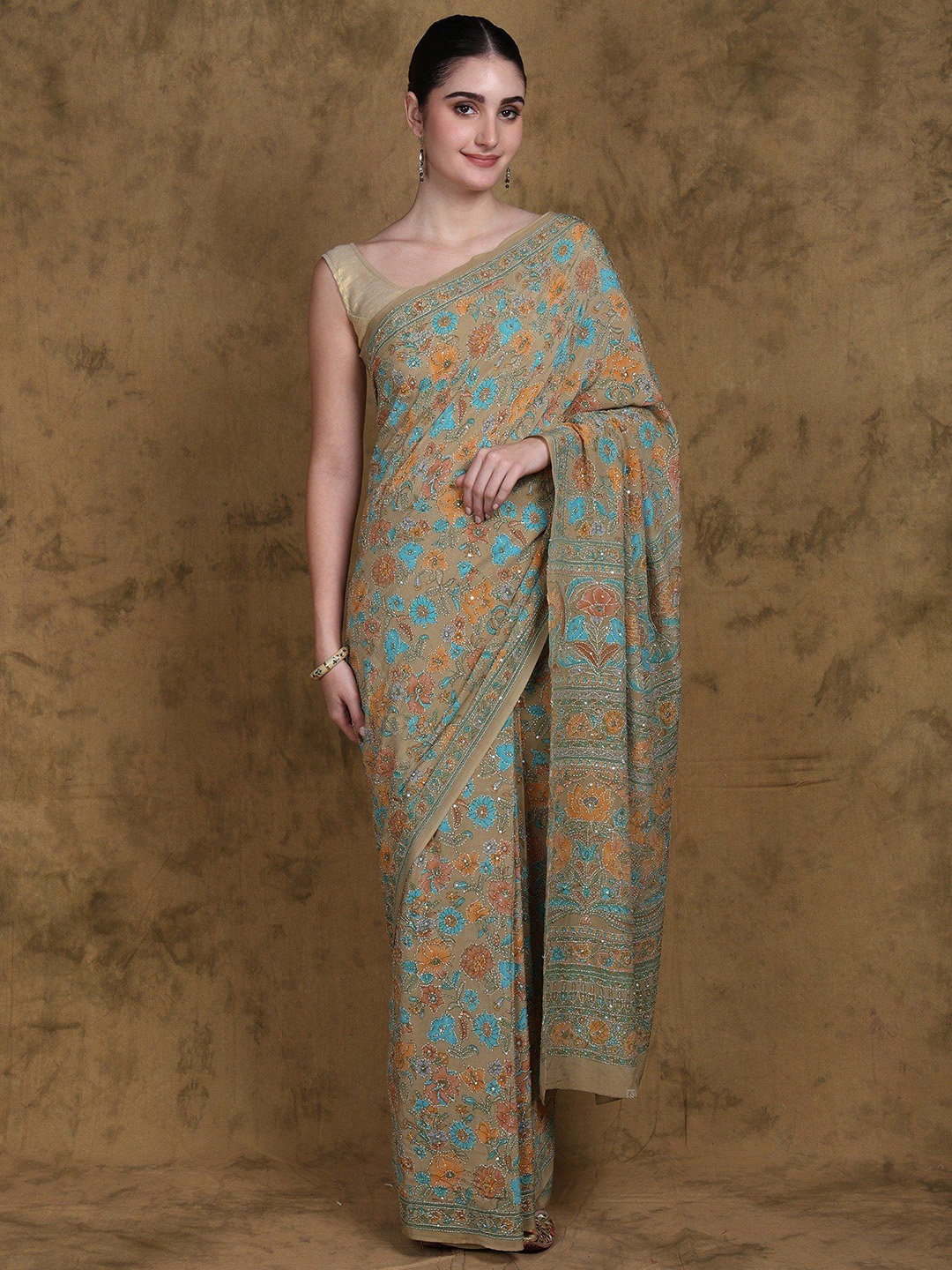 Exotic India Sage-Green Floral Printed Crepe Saree with Kantha Embroidery and Sequins work
Exotic India Sage-Green Floral Printed Crepe Saree with Kantha Embroidery and Sequins work
