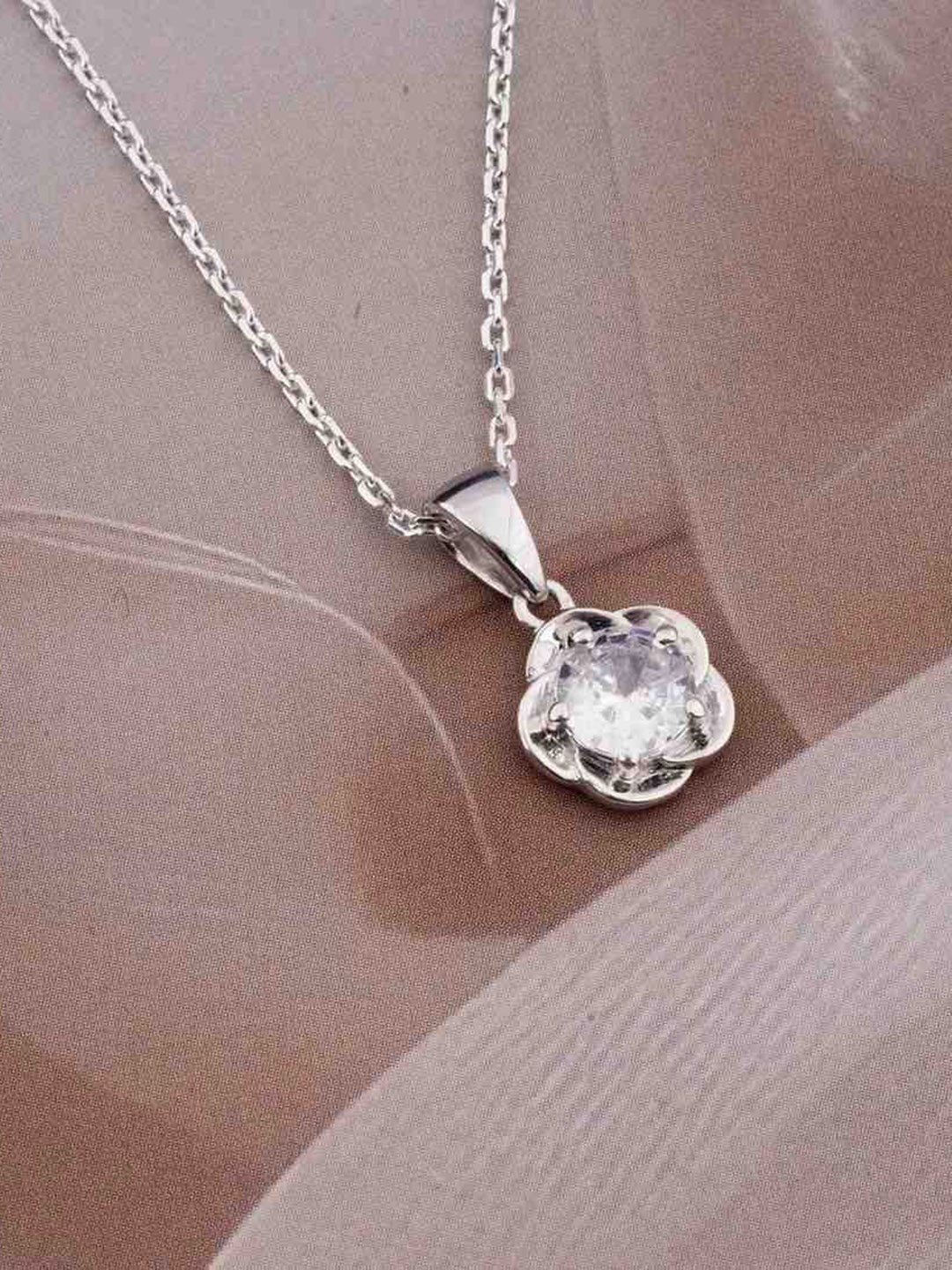 Zalkari Sterling Silver Rhodium-Plated Cubic Zirconia Studded Flower Solitaire Pendant
Zalkari Sterling Silver Rhodium-Plated Cubic Zirconia Studded Flower Solitaire Pendant