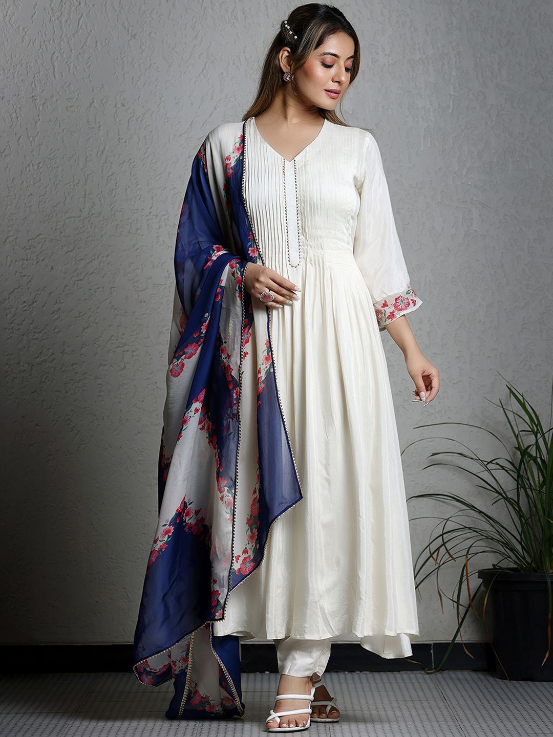 SUKRUTI Thread Work Pleated V-Neck Pure Silk Anarkali Kurta with Trousers And Dupatta, White
SUKRUTI Thread Work Pleated V-Neck Pure Silk Anarkali Kurta with Trousers And Dupatta, White