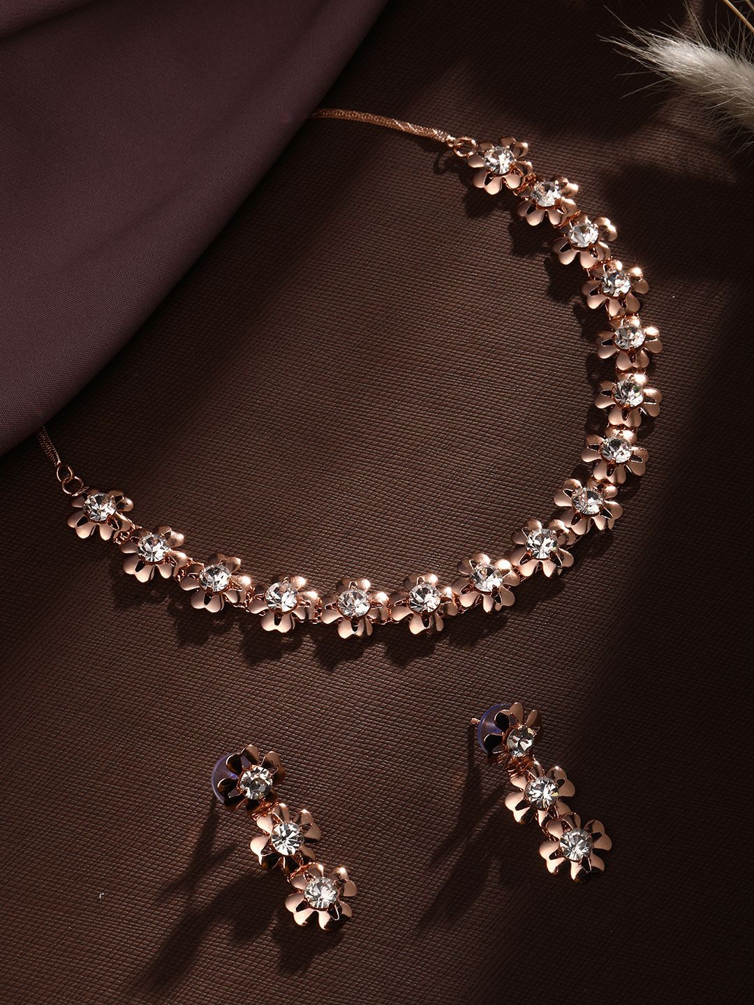 ASMITTA JEWELLERY Rose Gold-Plated American Diamond Studded Necklace and Earrings
ASMITTA JEWELLERY Rose Gold-Plated American Diamond Studded Necklace and Earrings