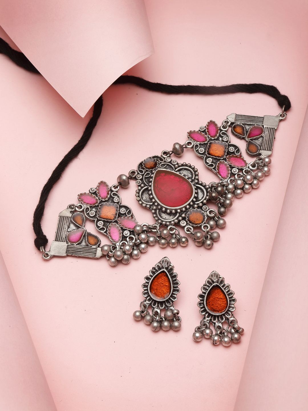 Moedbuille Silver-Plated Stone-Studded Meenakari Tribal Design Oxidised Jewellery Set
Moedbuille Silver-Plated Stone-Studded Meenakari Tribal Design Oxidised Jewellery Set