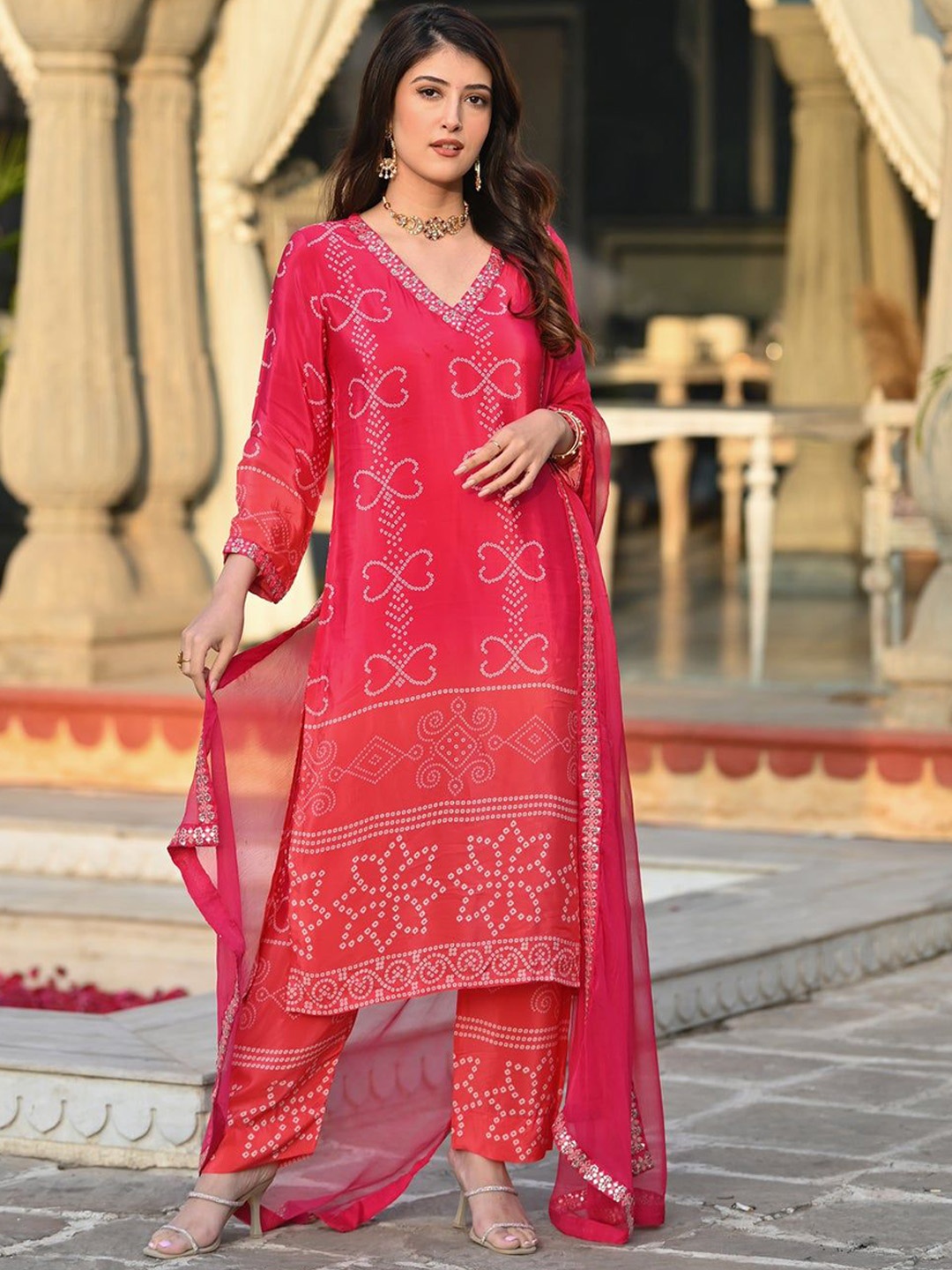 KAYOMMI Bandhani Printed V-Neck Mirror Work Chinon Straight Kurta With Trousers & Dupatta, Red
KAYOMMI Bandhani Printed V-Neck Mirror Work Chinon Straight Kurta With Trousers & Dupatta, Red