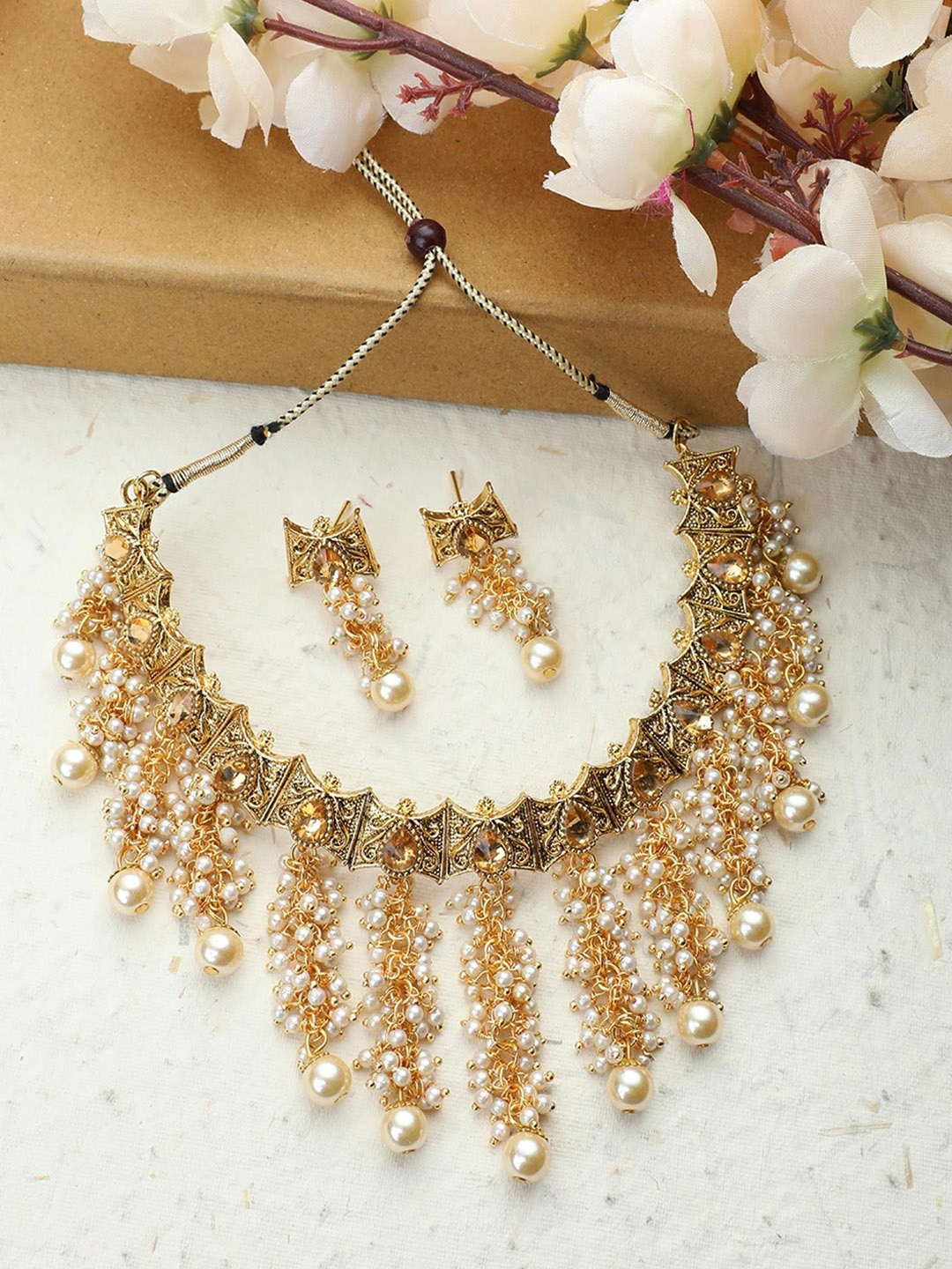 Jewels Guru Gold-Plated Tasselled Stone Studded & Pearls Beaded Choker Jewellery Set
Jewels Guru Gold-Plated Tasselled Stone Studded & Pearls Beaded Choker Jewellery Set