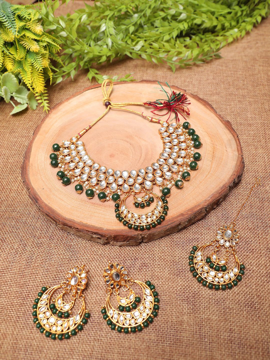Ethnicking Gold Plated Kundan Stone Studded & Beaded Necklace and Earrings With Maang Tika
Ethnicking Gold Plated Kundan Stone Studded & Beaded Necklace and Earrings With Maang Tika