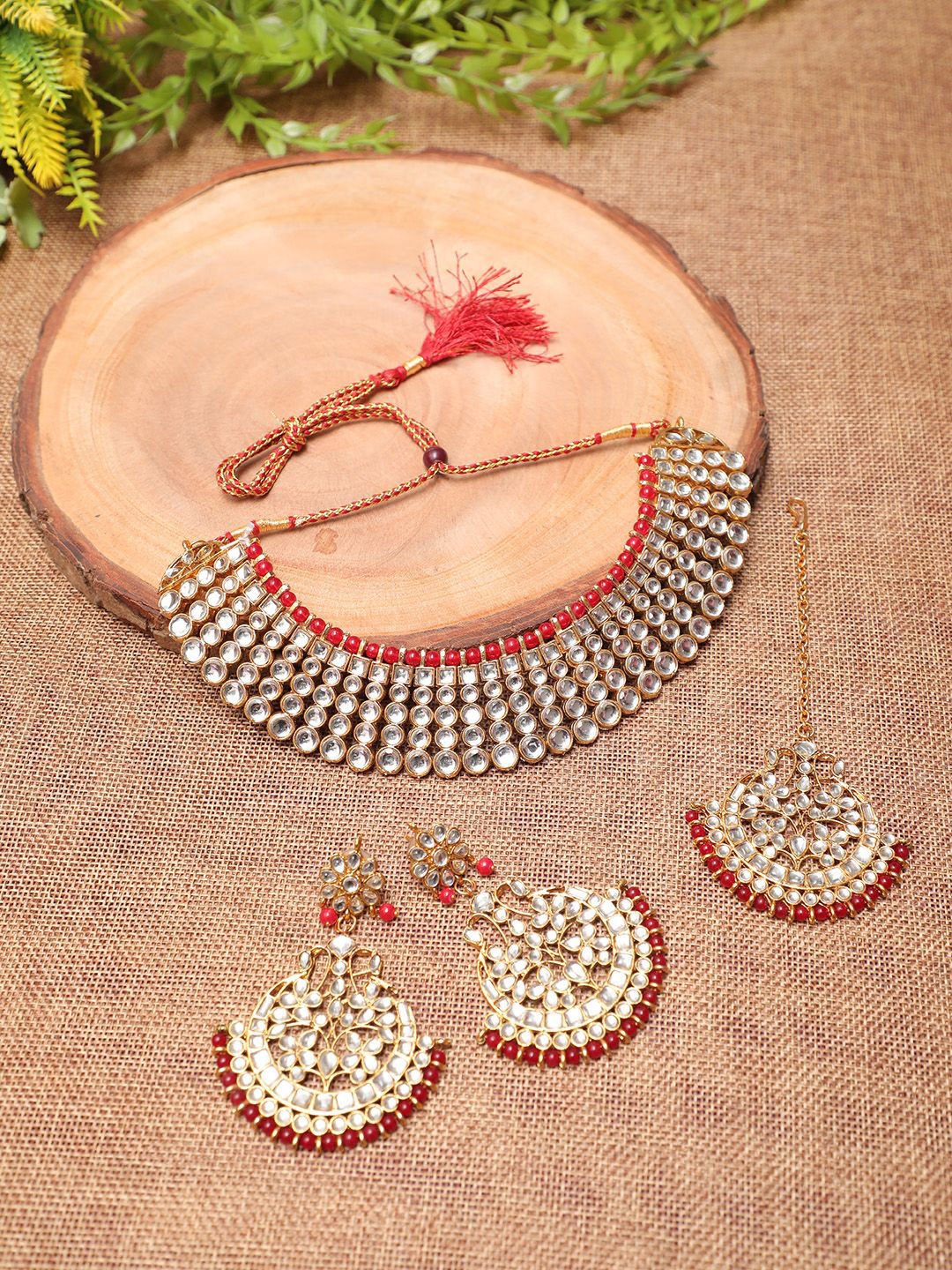 Ethnicking Gold Plated Kundan Stone Studded & Beaded Necklace and Earrings With Maang Tika
Ethnicking Gold Plated Kundan Stone Studded & Beaded Necklace and Earrings With Maang Tika