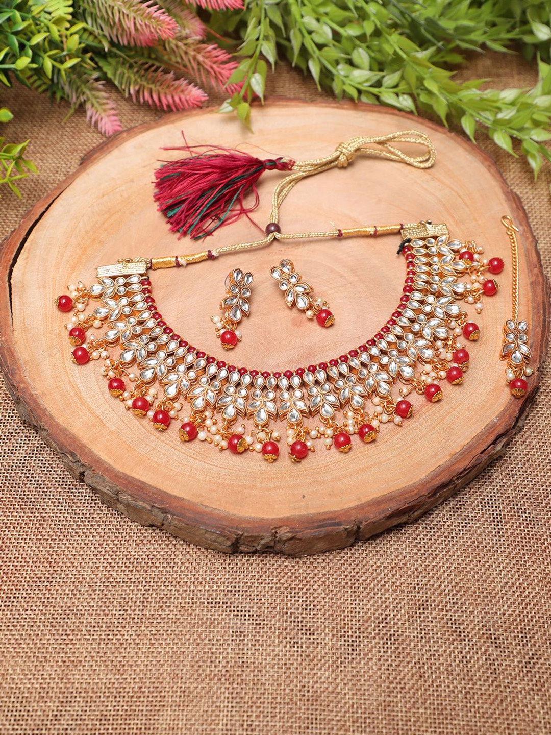 Ethnicking Gold Plated Kundan Stone Studded & Beaded Necklace and Earrings With Maang Tika
Ethnicking Gold Plated Kundan Stone Studded & Beaded Necklace and Earrings With Maang Tika