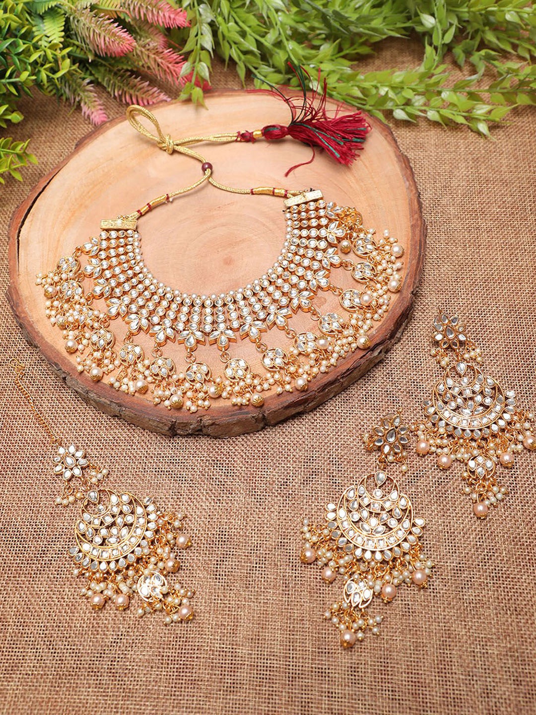 Ethnicking Gold Plated Kundan Stone Studded & Beaded Necklace and Earrings With Maang Tika
Ethnicking Gold Plated Kundan Stone Studded & Beaded Necklace and Earrings With Maang Tika