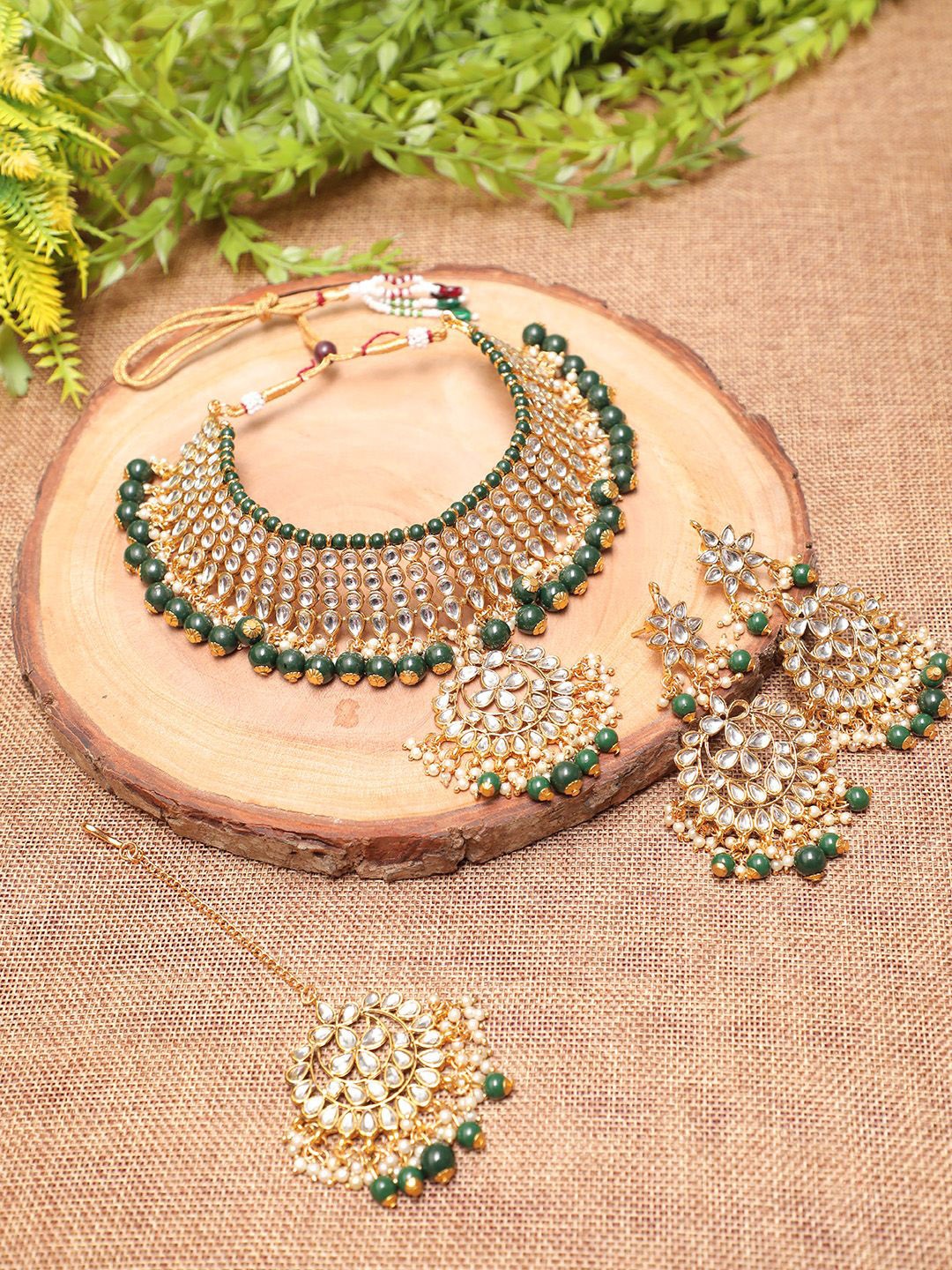 Ethnicking Gold Plated Kundan Stone Studded & Beaded Necklace and Earrings With Maang Tika
Ethnicking Gold Plated Kundan Stone Studded & Beaded Necklace and Earrings With Maang Tika