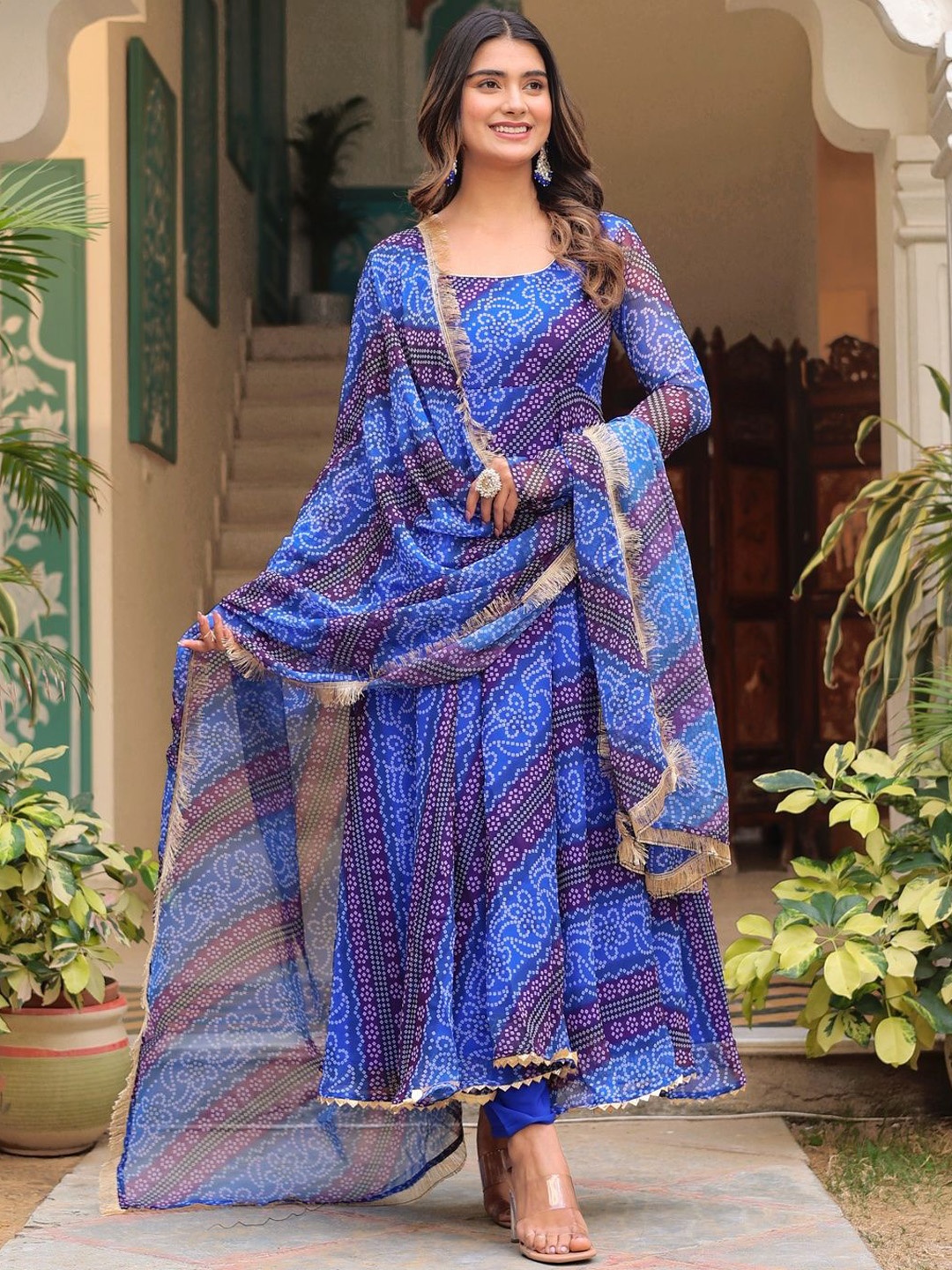 BYUTIFY Bandhani Printed Round Neck Georgette Anarkali Kurta With Trouser And Dupatta, Blue
BYUTIFY Bandhani Printed Round Neck Georgette Anarkali Kurta With Trouser And Dupatta, Blue