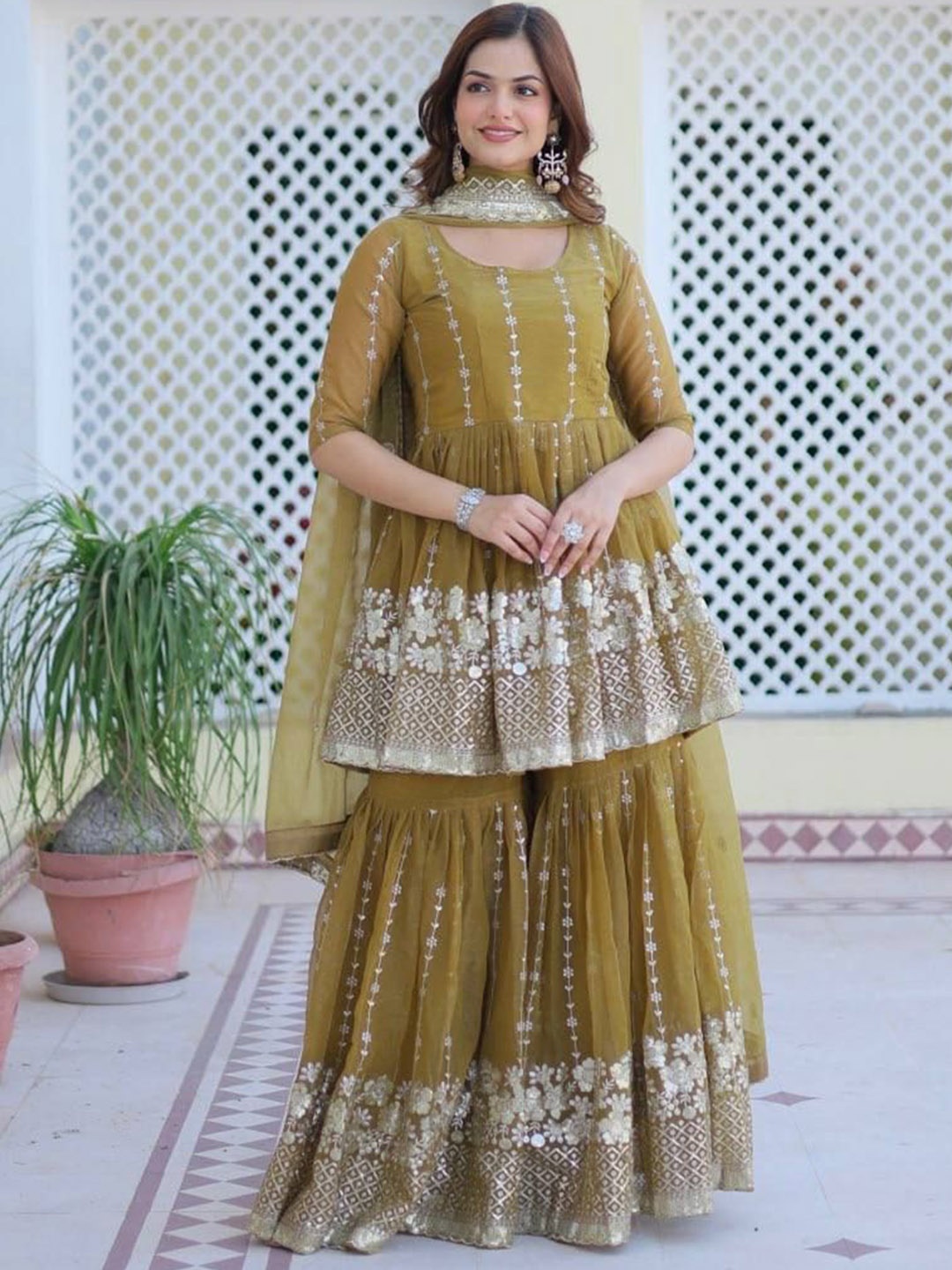 KALINI Women Floral Embroidered Angrakha Thread Work Kurta with Sharara & With Dupatta, Olive
KALINI Women Floral Embroidered Angrakha Thread Work Kurta with Sharara & With Dupatta, Olive