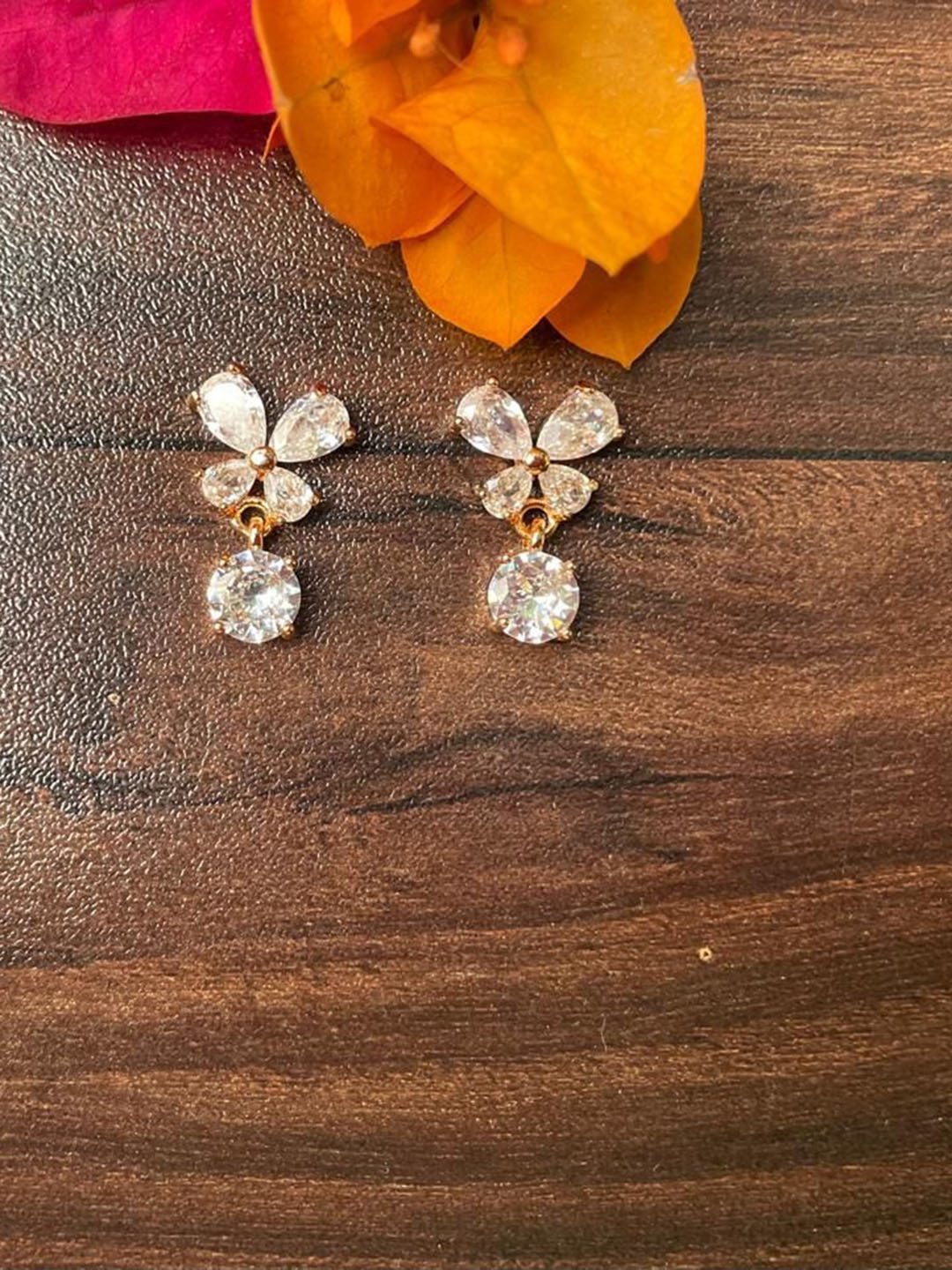 MONI LIFESTYLE Rose Gold Plated Artificial Stones Studded Contemporary Studs
MONI LIFESTYLE Rose Gold Plated Artificial Stones Studded Contemporary Studs