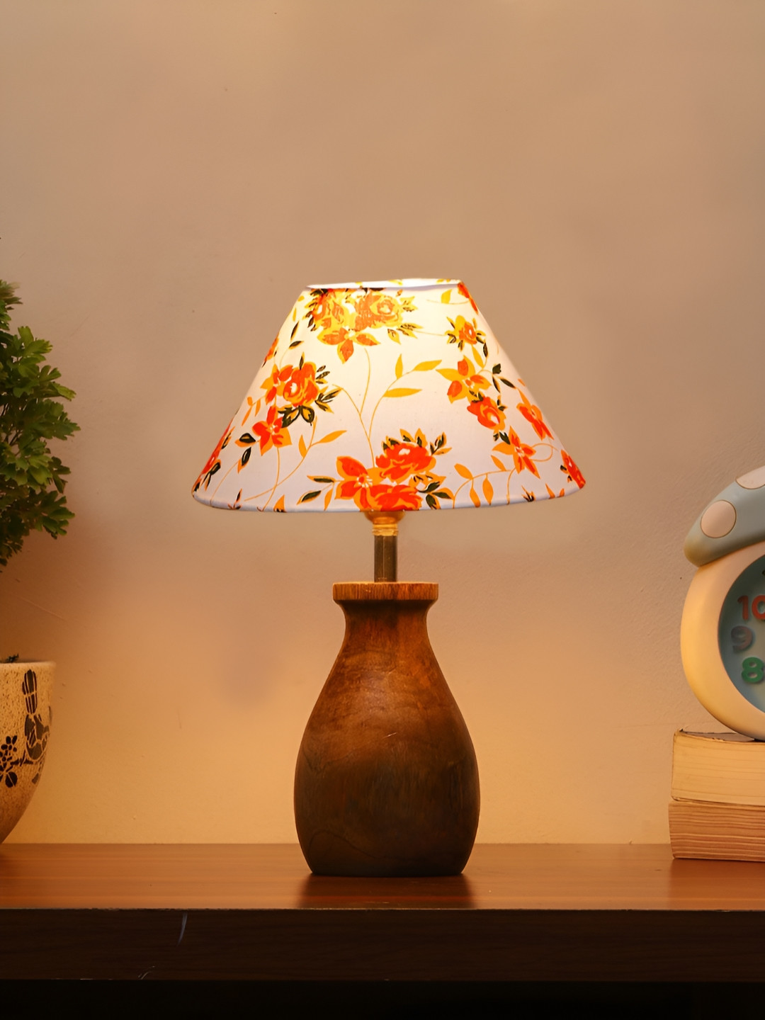 Aura Grey Floral Printed Frustum Shaped Cotton Shade Table Lamp With Wooden Natural Base
Aura Grey Floral Printed Frustum Shaped Cotton Shade Table Lamp With Wooden Natural Base