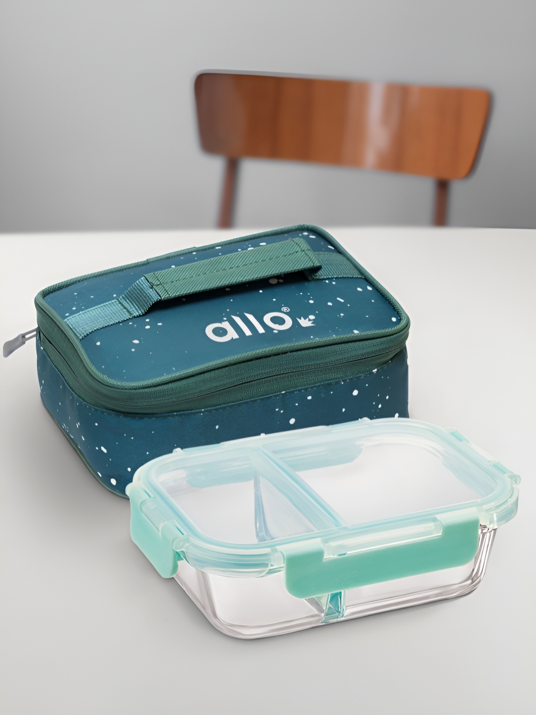 Allo Transparent & Sea Green Glass Microwave Safe Lunch Box With Chevron Printed Bag
Allo Transparent & Sea Green Glass Microwave Safe Lunch Box With Chevron Printed Bag