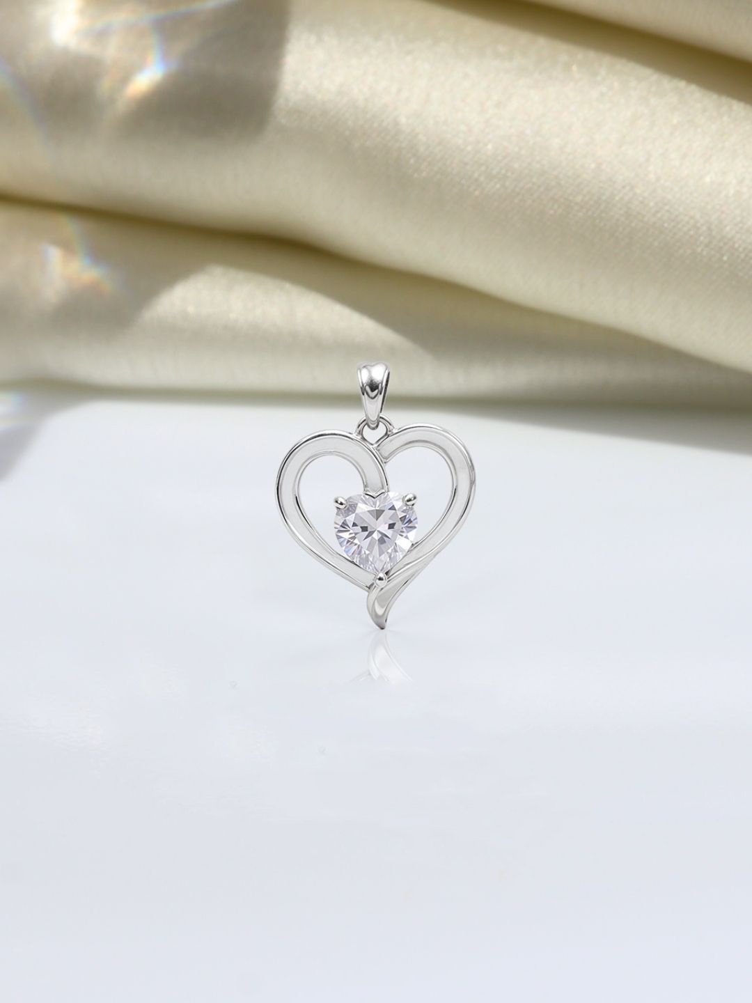 HighSpark 92.5 Sterling Silver Crystal & Cubic Zirconia Studded Heart Solitaire Pendant
HighSpark 92.5 Sterling Silver Crystal & Cubic Zirconia Studded Heart Solitaire Pendant