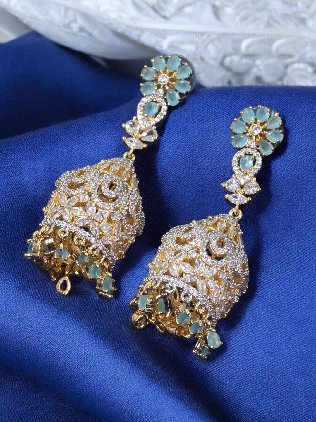 SHARLEEZ Rhodium-Plated 18 K Gold Polished American Diamond Studded Dome Shaped Jhumkas, Blue
SHARLEEZ Rhodium-Plated 18 K Gold Polished American Diamond Studded Dome Shaped Jhumkas, Blue