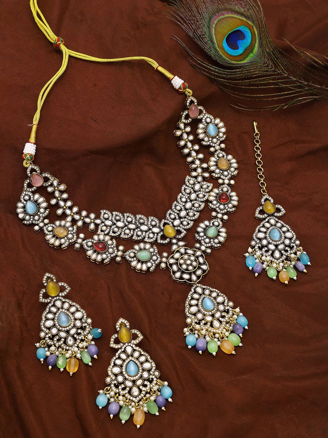 Exotic India Multicolor AD Stone with Drop Beads Necklace with Earrings and Mangtika Set, Silver
Exotic India Multicolor AD Stone with Drop Beads Necklace with Earrings and Mangtika Set, Silver