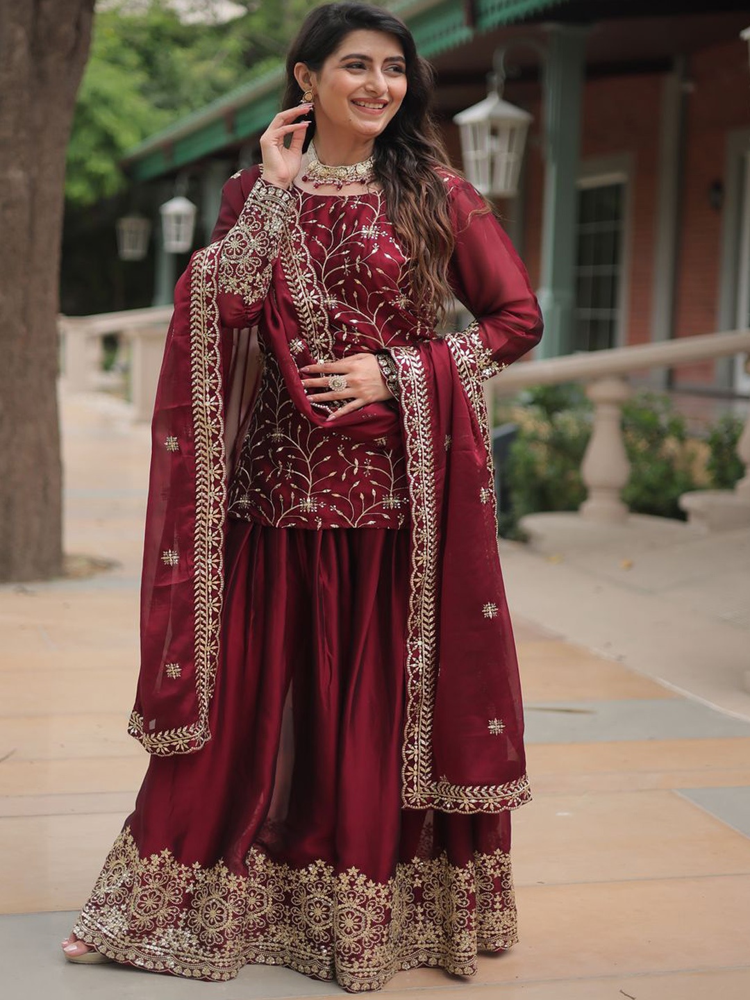 KALINI Floral Embroidered Mirror Work Boat Neck Straight Kurta with Sharara And Dupatta, Maroon
KALINI Floral Embroidered Mirror Work Boat Neck Straight Kurta with Sharara And Dupatta, Maroon