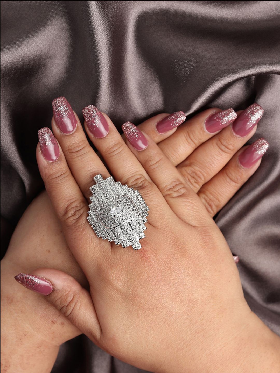 RHOSYN Silver-Plated Cubic Zirconia & American Diamond Studded Adjustable Finger Ring
RHOSYN Silver-Plated Cubic Zirconia & American Diamond Studded Adjustable Finger Ring