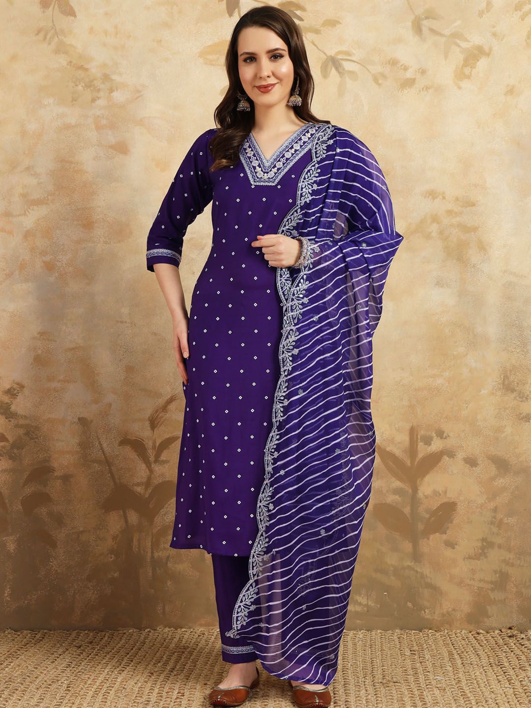 KALINI Bandhani Thread Work V-Neck Straight Kurta With Trousers And Dupatta, Purple
KALINI Bandhani Thread Work V-Neck Straight Kurta With Trousers And Dupatta, Purple