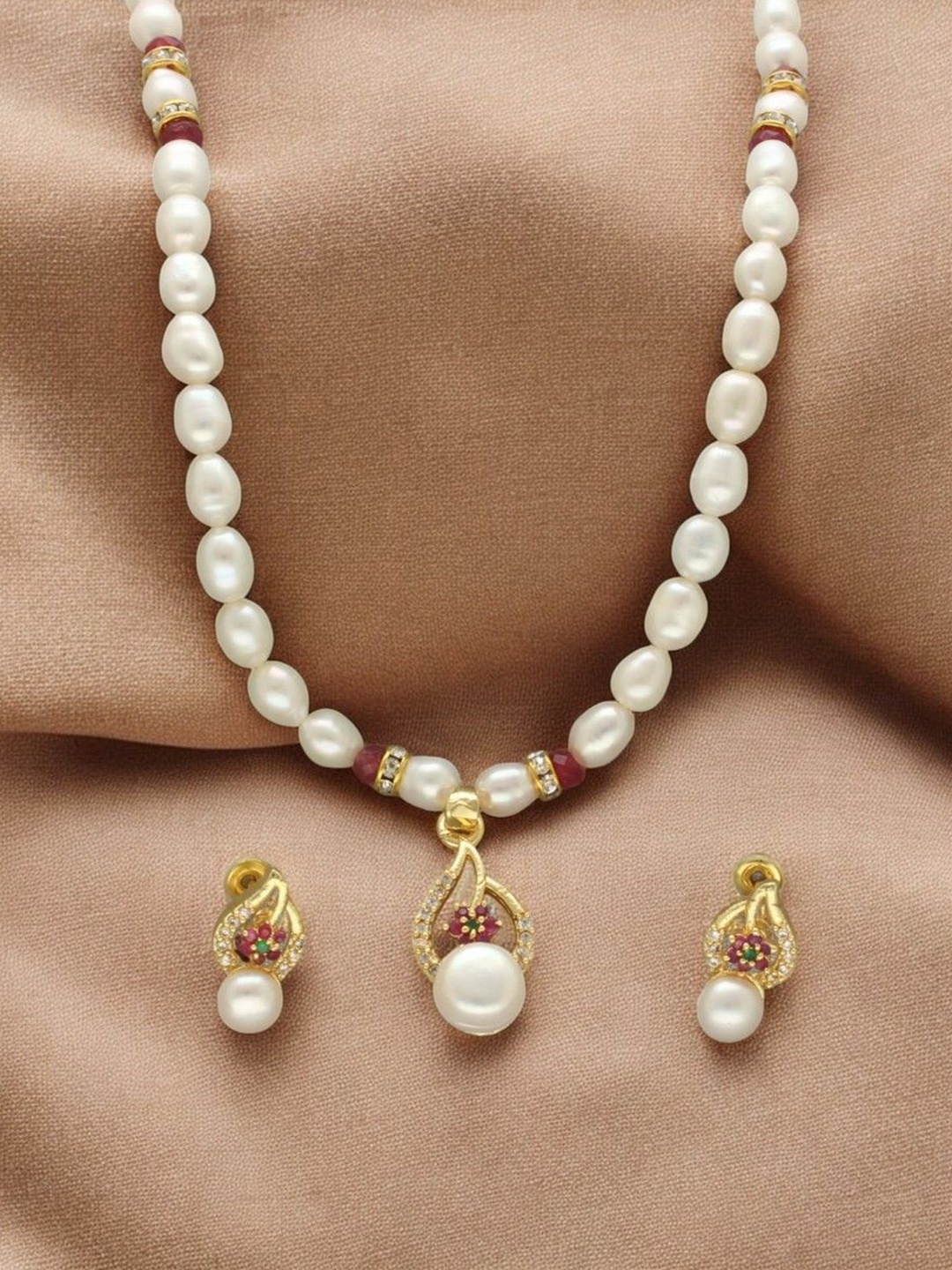 Sri Jagdamba Pearls Dealer Gold Plated CZ Stone Studded & Beaded Necklace and Earrings
Sri Jagdamba Pearls Dealer Gold Plated CZ Stone Studded & Beaded Necklace and Earrings