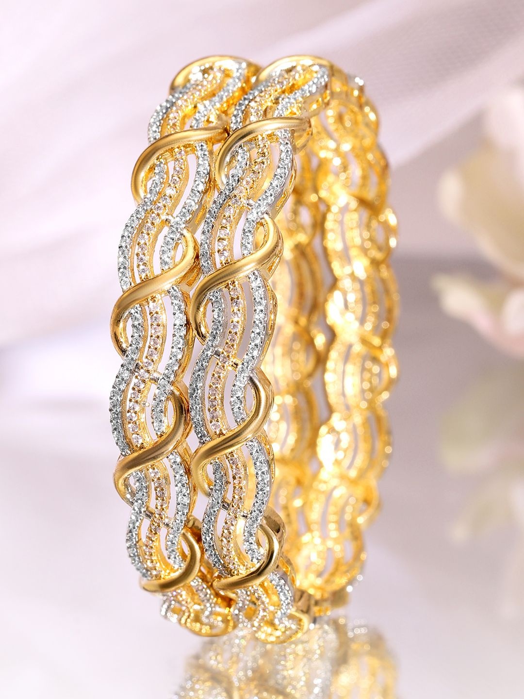 Rubans Set of 2 Rhodium & 18K Gold-Plated Cubic Zirconia Studded Premium Bangles
Rubans Set of 2 Rhodium & 18K Gold-Plated Cubic Zirconia Studded Premium Bangles