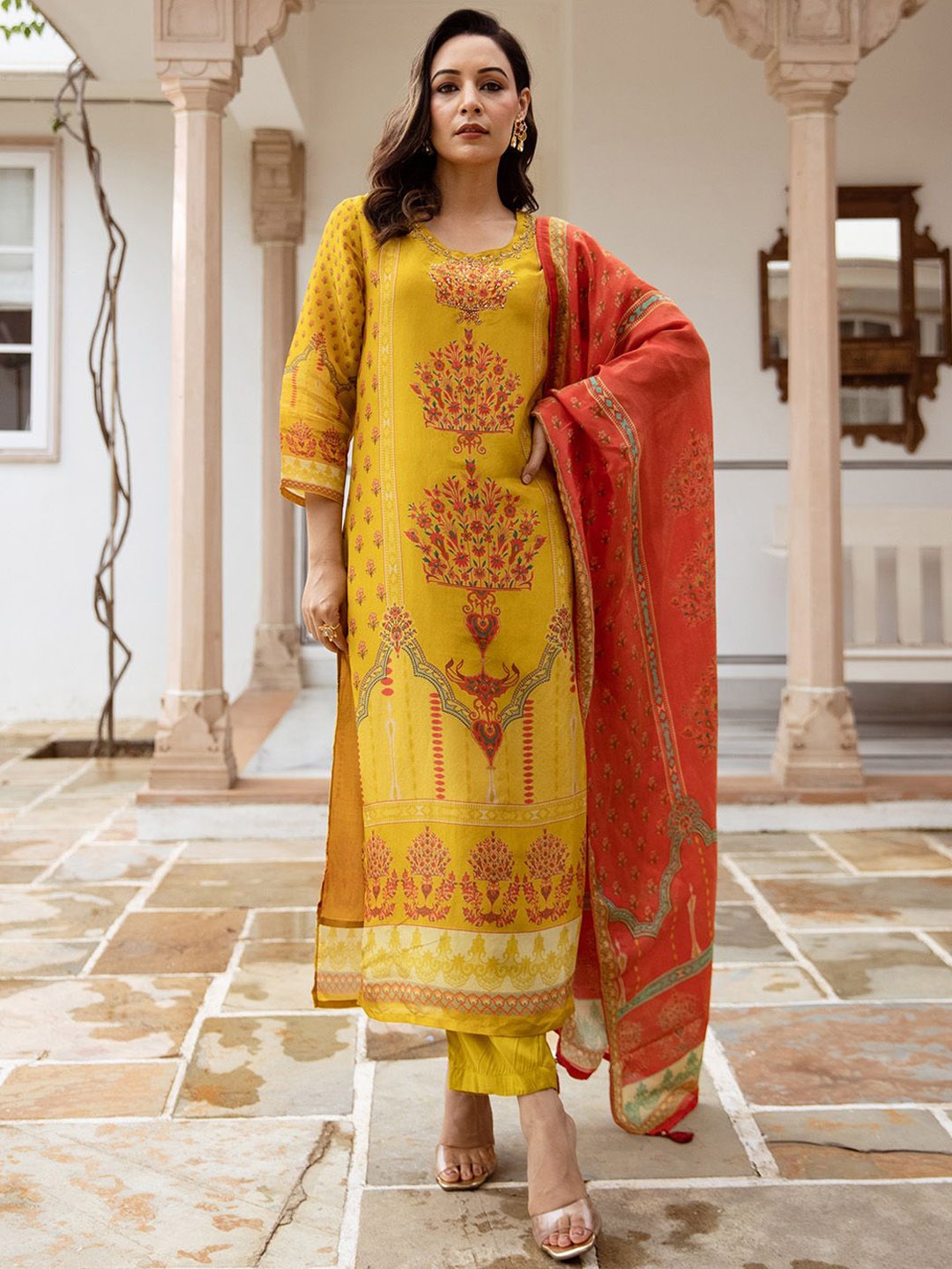 Ishin Floral Printed Beads And Stones Straight Kurta With Trousers And Dupatta, Mustard
Ishin Floral Printed Beads And Stones Straight Kurta With Trousers And Dupatta, Mustard