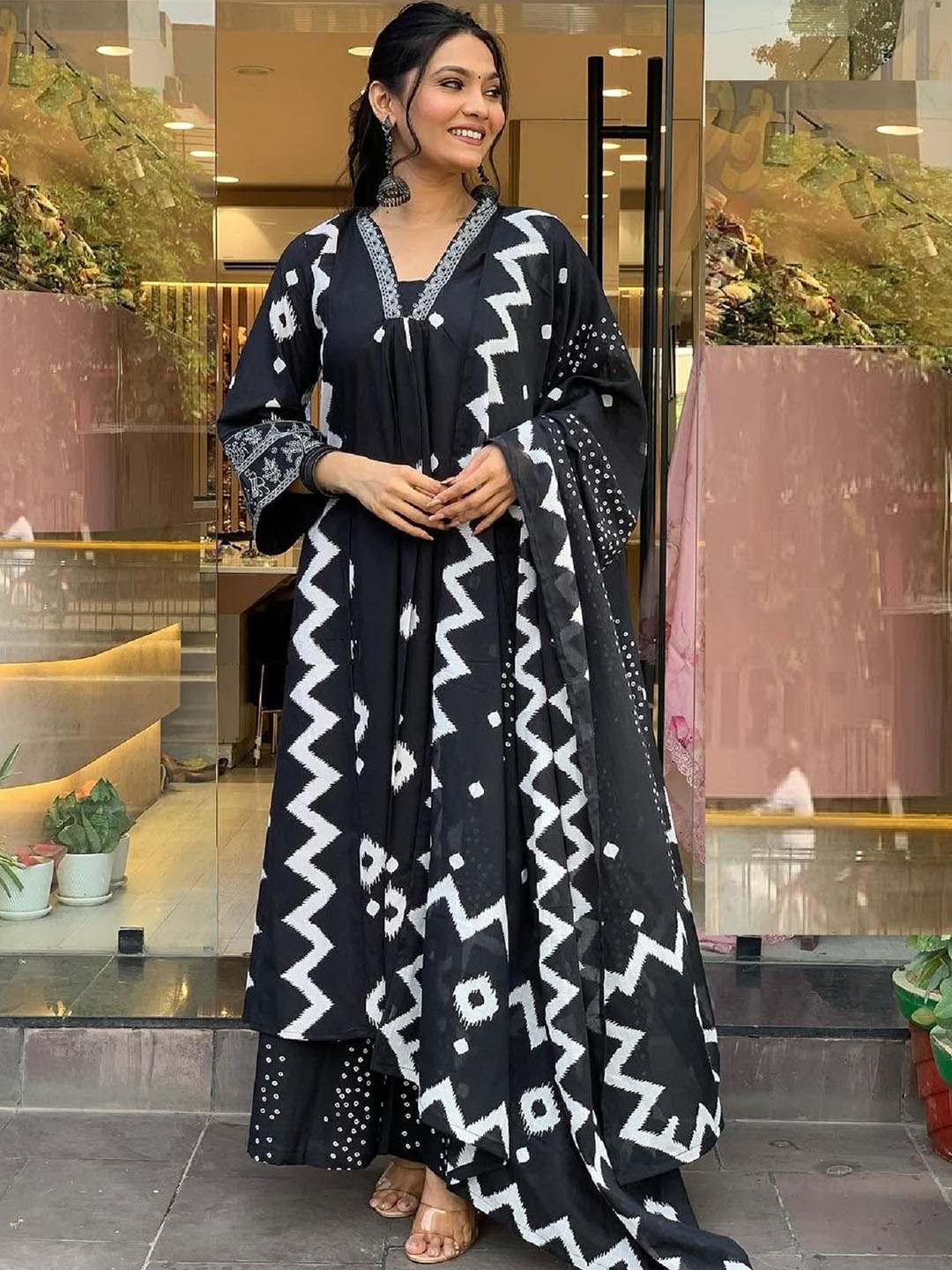 KALINI Geometric Printed Notch Neck Pleated A-Line Kurta With Trouser And Dupatta, Black
KALINI Geometric Printed Notch Neck Pleated A-Line Kurta With Trouser And Dupatta, Black