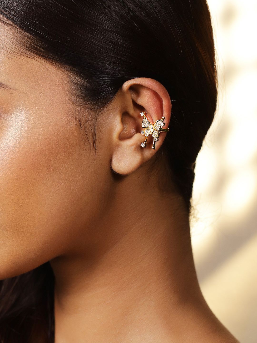 Rubans Voguish 18K Gold Plated Cubic Zirconia Studded Butterfly Design Statement Ear Cuff
Rubans Voguish 18K Gold Plated Cubic Zirconia Studded Butterfly Design Statement Ear Cuff