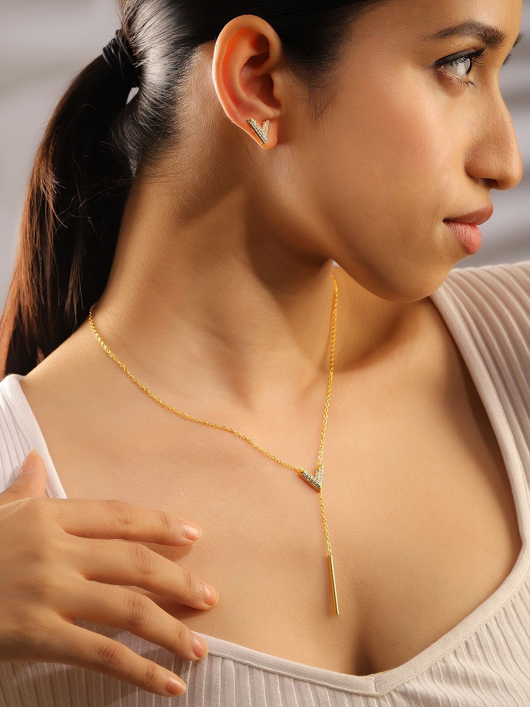 Rubans 18K Gold Plated Cubic Zirconia Studded V Shape Pendant Necklace & Earrings Set
Rubans 18K Gold Plated Cubic Zirconia Studded V Shape Pendant Necklace & Earrings Set