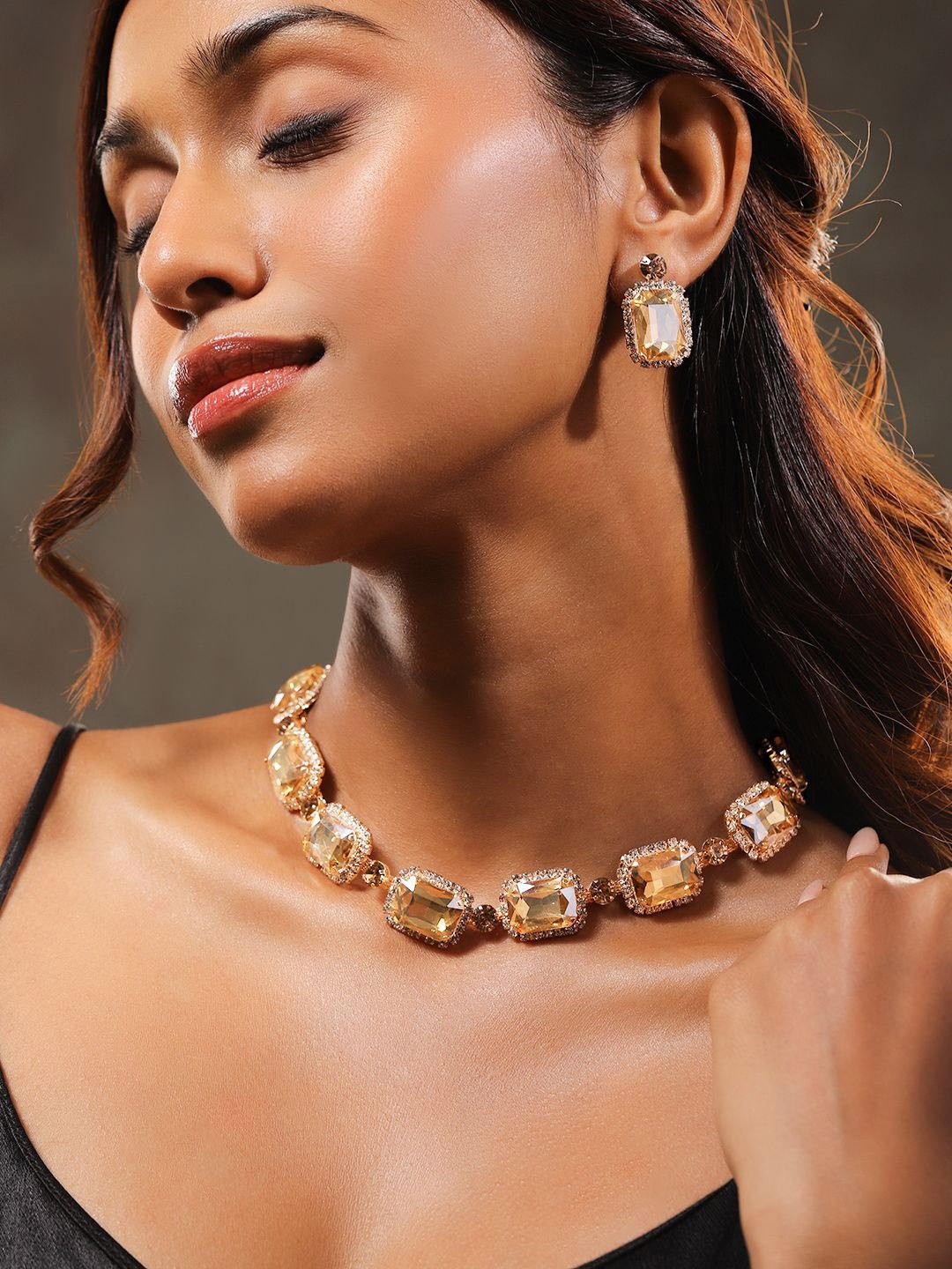 Rubans 22K Gold Plated Golden Crystal & Cubic Zirconia Studded Bold Statement Jewelry Set
Rubans 22K Gold Plated Golden Crystal & Cubic Zirconia Studded Bold Statement Jewelry Set