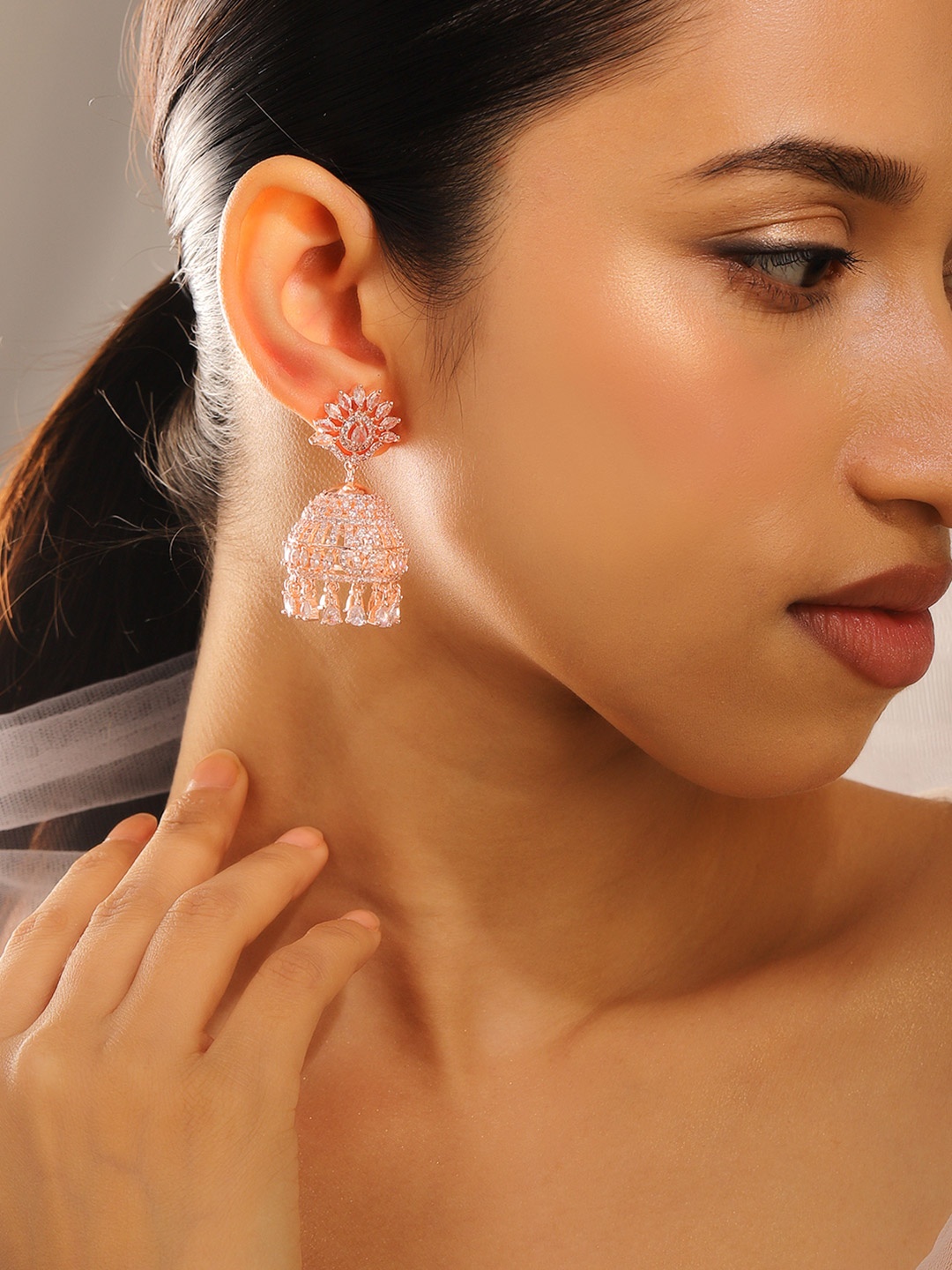 Rubans 18K Rose Gold Plated Cubic Zirconia Studded Dome Shaped Statement Jhumka
Rubans 18K Rose Gold Plated Cubic Zirconia Studded Dome Shaped Statement Jhumka