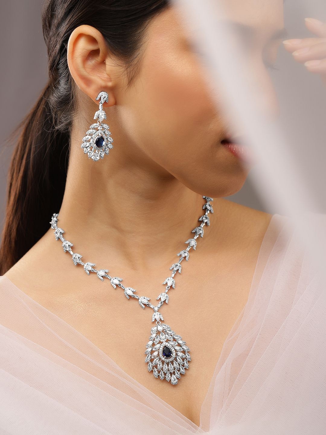 Rubans Rhodium-Plated Blue Sapphire & White Cubic Zirconia Studded Luxe Drop Necklace Set, Silver
Rubans Rhodium-Plated Blue Sapphire & White Cubic Zirconia Studded Luxe Drop Necklace Set, Silver