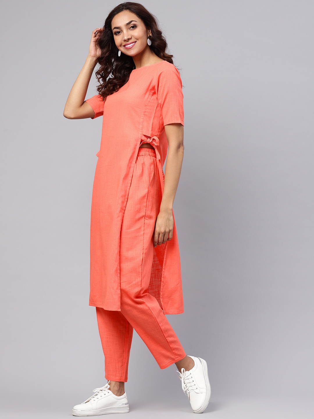 Idalia Women Coral Orange Solid Kurta with Trousers