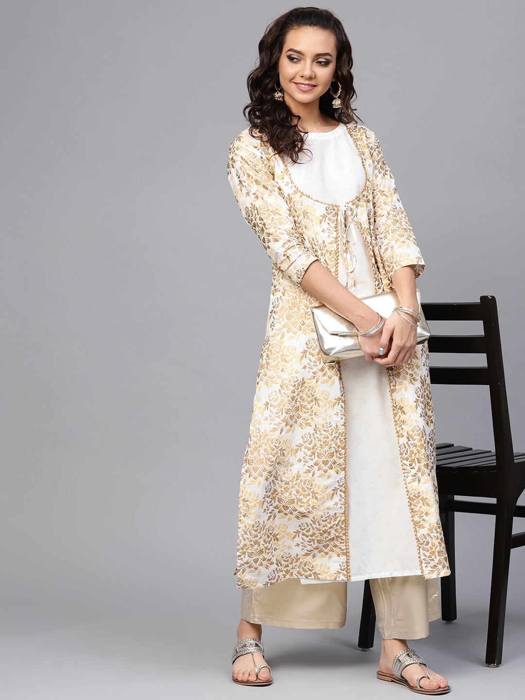 Ahalyaa Women Off-White Golden Printed Straight Cotton Kurta with Attached Jacket
Ahalyaa Women Off-White Golden Printed Straight Cotton Kurta with Attached Jacket