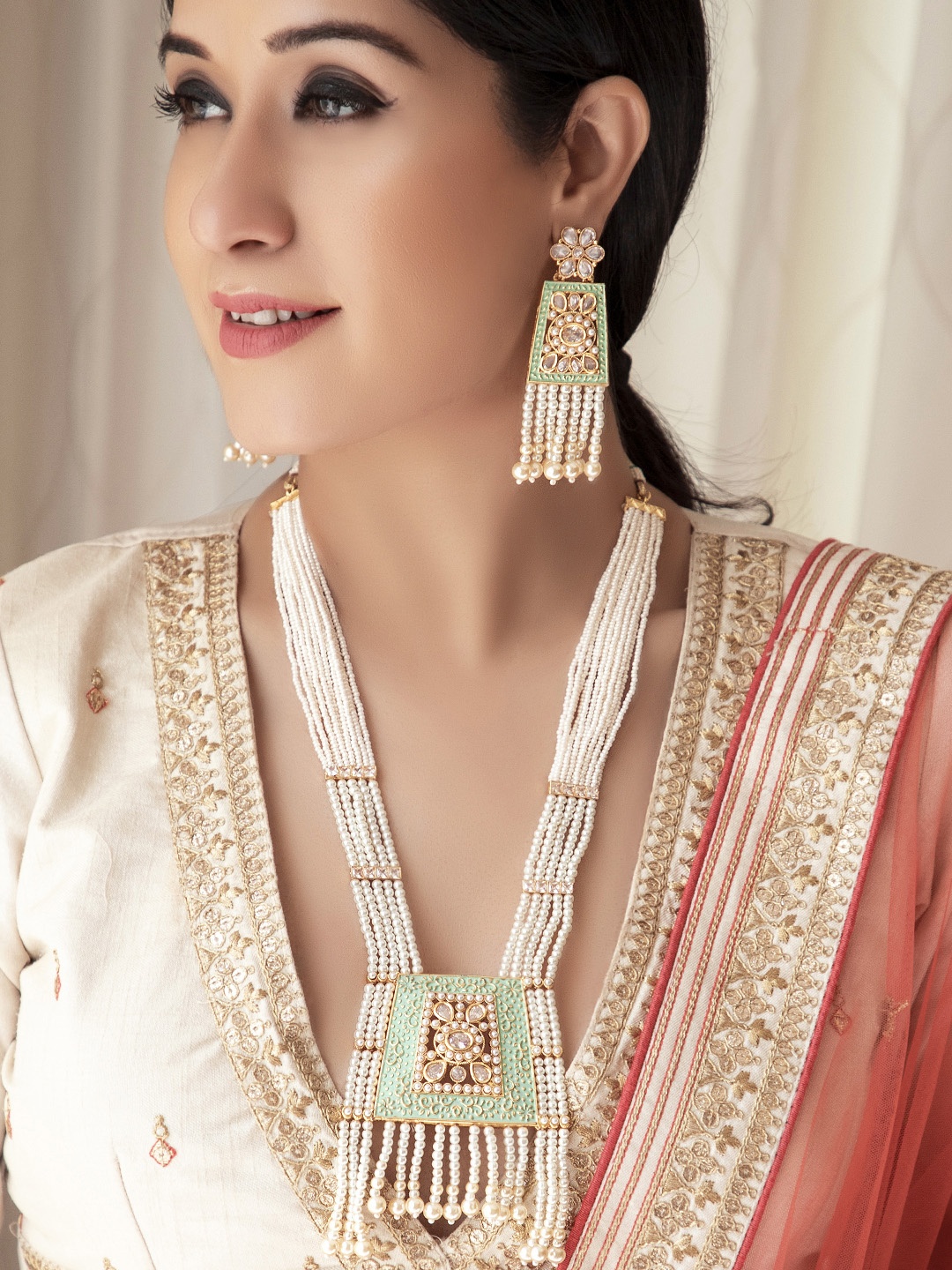 Rubans Women Gold-Toned, Off-White & Green Enamelled Pearl Beaded Handcrafted Jewellery Set
Rubans Women Gold-Toned, Off-White & Green Enamelled Pearl Beaded Handcrafted Jewellery Set
