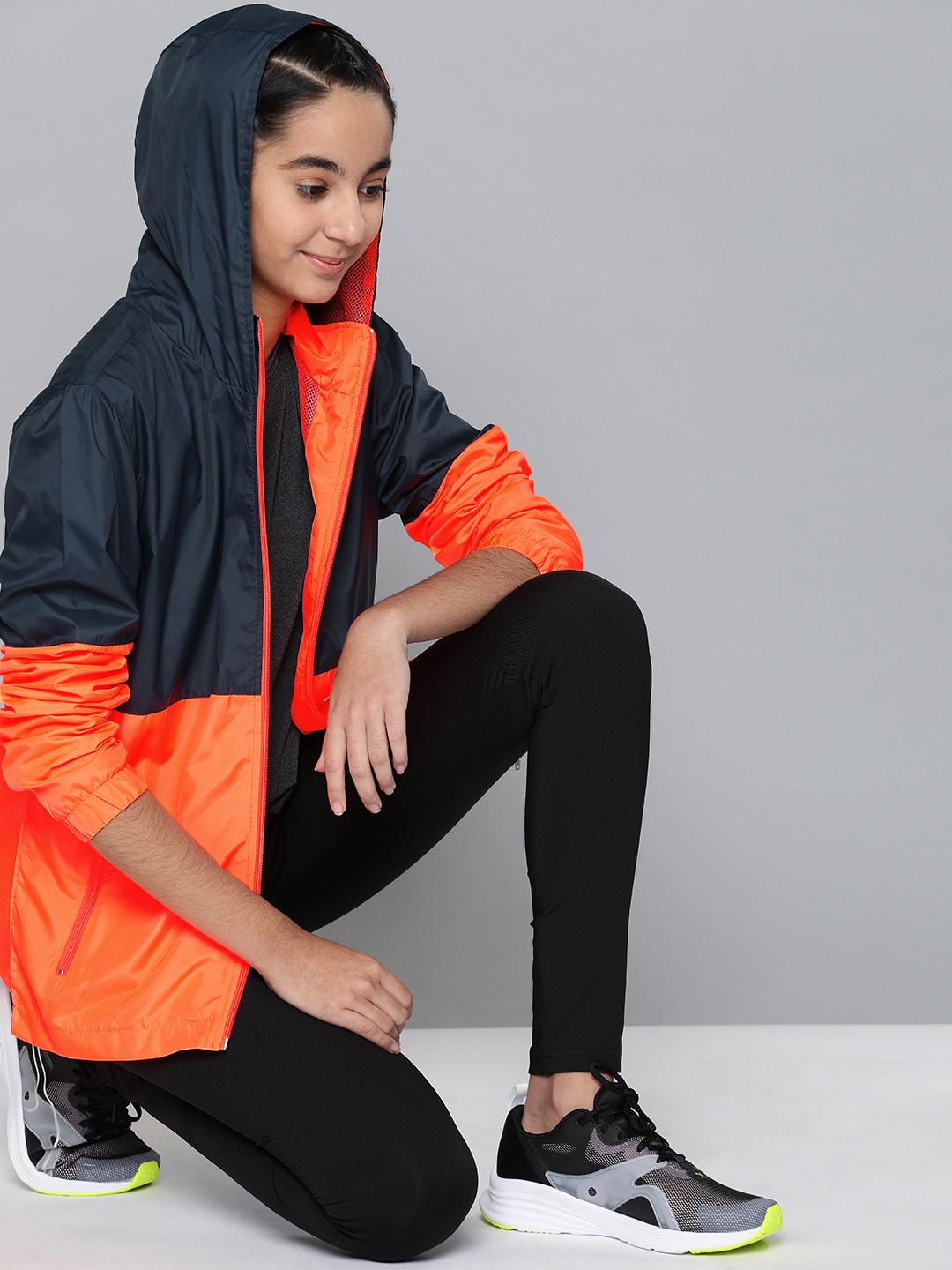 HRX by Hrithik Roshan Girls Navy & Neon Orange Colourblocked Hooded Running Sporty Jacket, Navy blue
HRX by Hrithik Roshan Girls Navy & Neon Orange Colourblocked Hooded Running Sporty Jacket, Navy blue