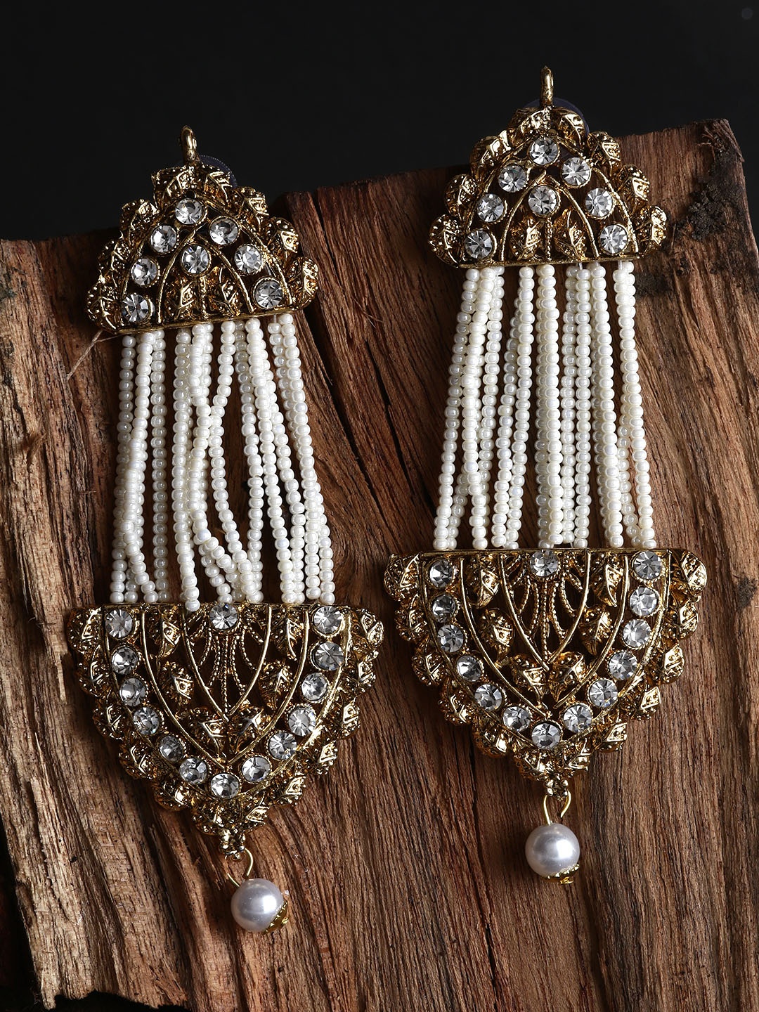 ANIKAS CREATION White & Gold-Plated Handcrafted Kundan Pearl Studded Multistrand Earrings
ANIKAS CREATION White & Gold-Plated Handcrafted Kundan Pearl Studded Multistrand Earrings