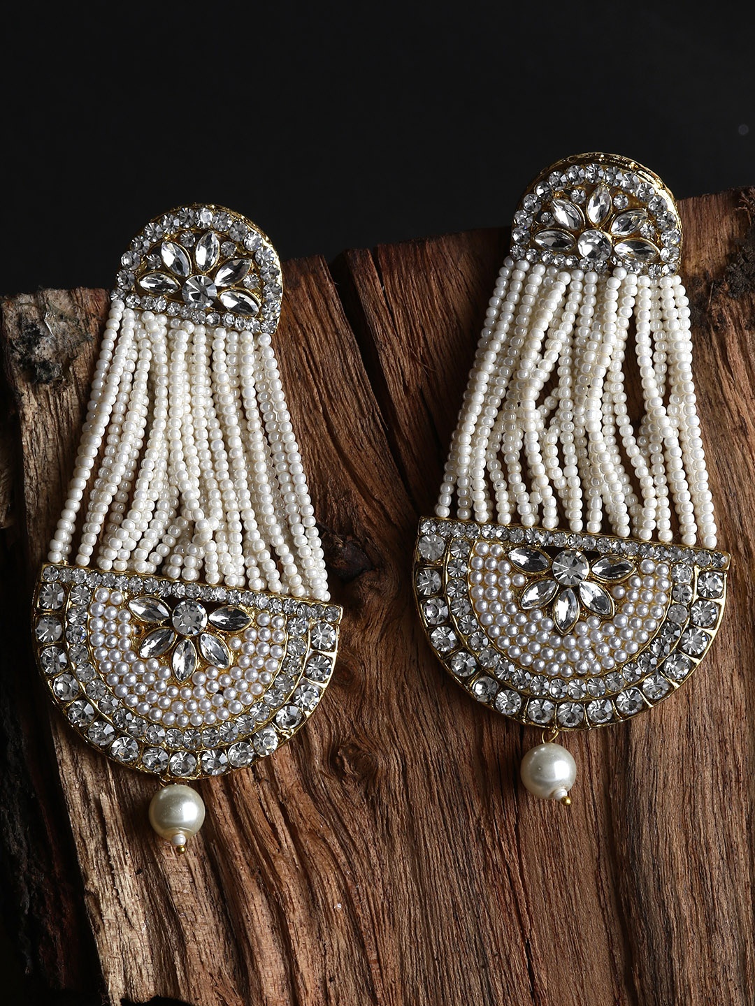 ANIKAS CREATION White & Gold-Plated Handcrafted Kundan Pearl Studded Multistrand Earrings
ANIKAS CREATION White & Gold-Plated Handcrafted Kundan Pearl Studded Multistrand Earrings