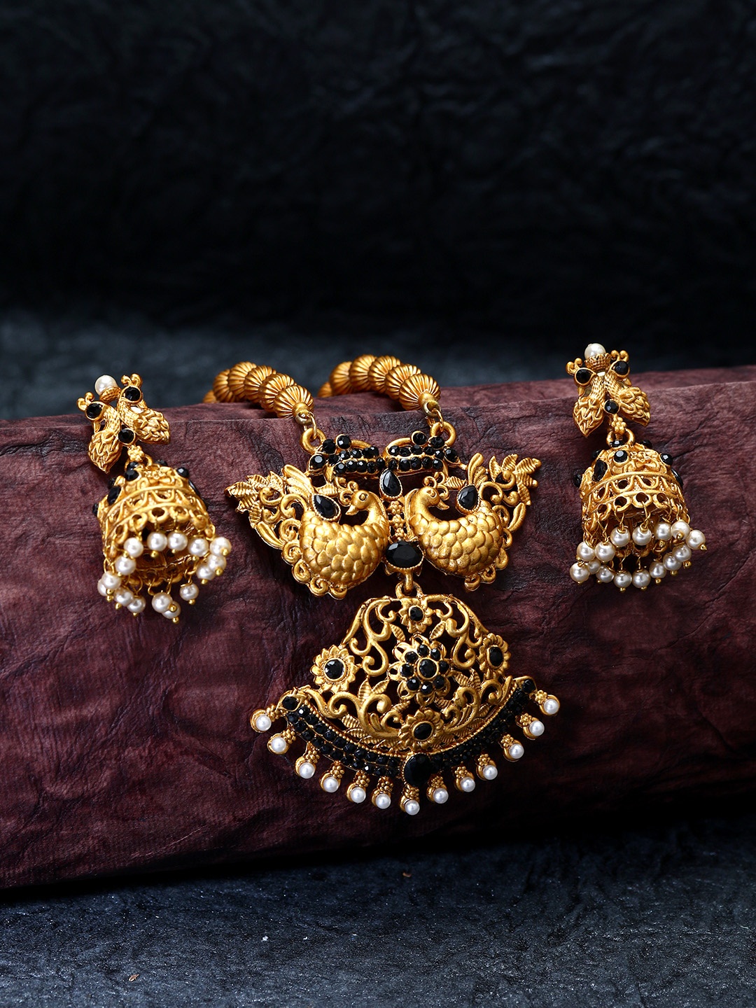 ANIKAS CREATION Gold-Plated & Black Embellished Beaded Peacock Shape Temple Jewellery Set
ANIKAS CREATION Gold-Plated & Black Embellished Beaded Peacock Shape Temple Jewellery Set