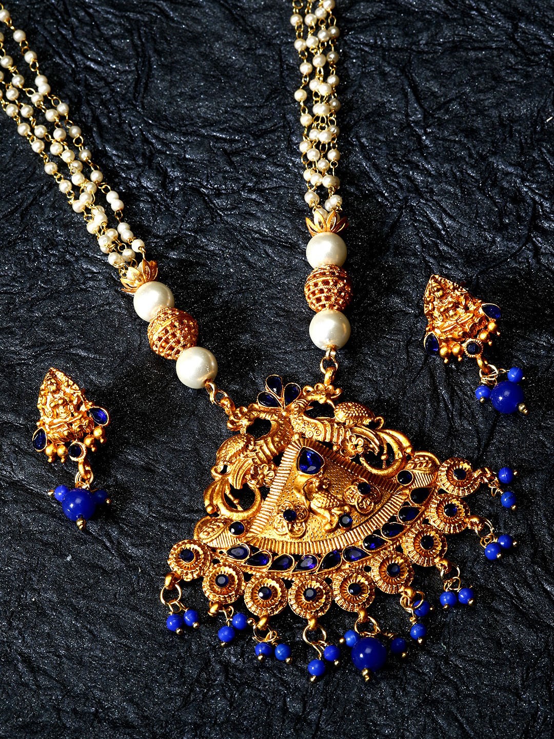 ANIKAS CREATION Gold-Plated & Navy Stone-Studded & Beaded Maa Laxmi Temple Jewellery Set
ANIKAS CREATION Gold-Plated & Navy Stone-Studded & Beaded Maa Laxmi Temple Jewellery Set