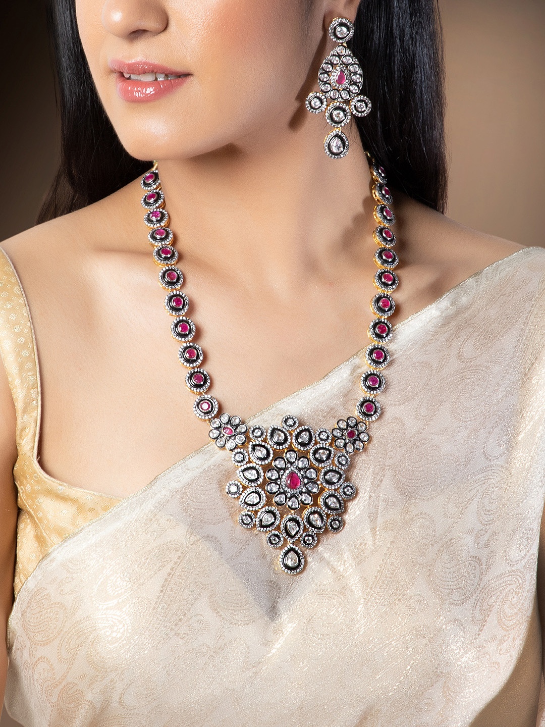 Rubans Women Gold Plated, Black & Pink CZ Studded Faux Ruby Embellished Jewellery Set
Rubans Women Gold Plated, Black & Pink CZ Studded Faux Ruby Embellished Jewellery Set