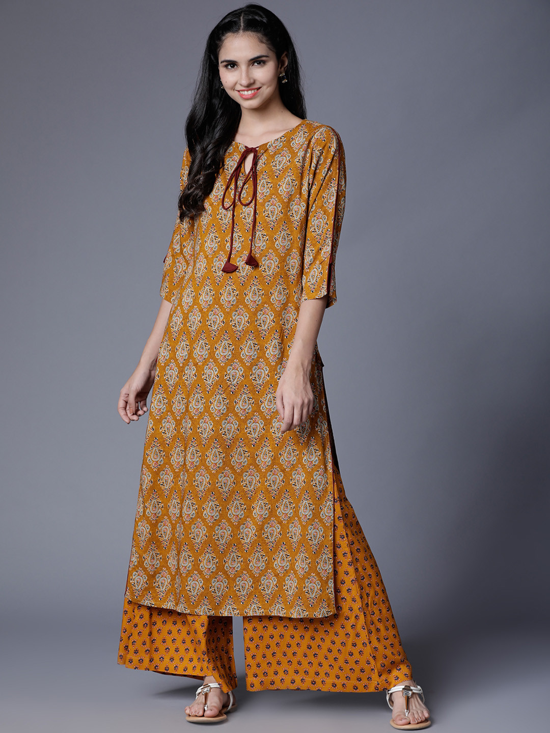 Vishudh Women Mustard Yellow Printed Kurta with Palazzos
Vishudh Women Mustard Yellow Printed Kurta with Palazzos