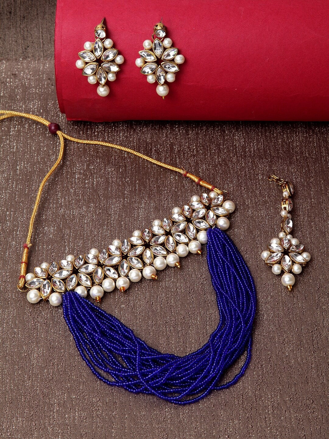 ANIKAS CREATION Gold-Plated White & Blue Kundan-Studded Beaded Handcrafted Jewellery Set
ANIKAS CREATION Gold-Plated White & Blue Kundan-Studded Beaded Handcrafted Jewellery Set