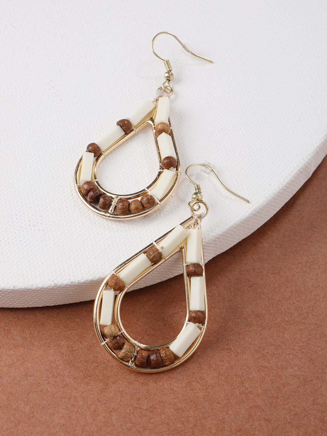 STREET 9 Cream-Coloured & Brown Teardrop Shaped Drop Earrings
STREET 9 Cream-Coloured & Brown Teardrop Shaped Drop Earrings
