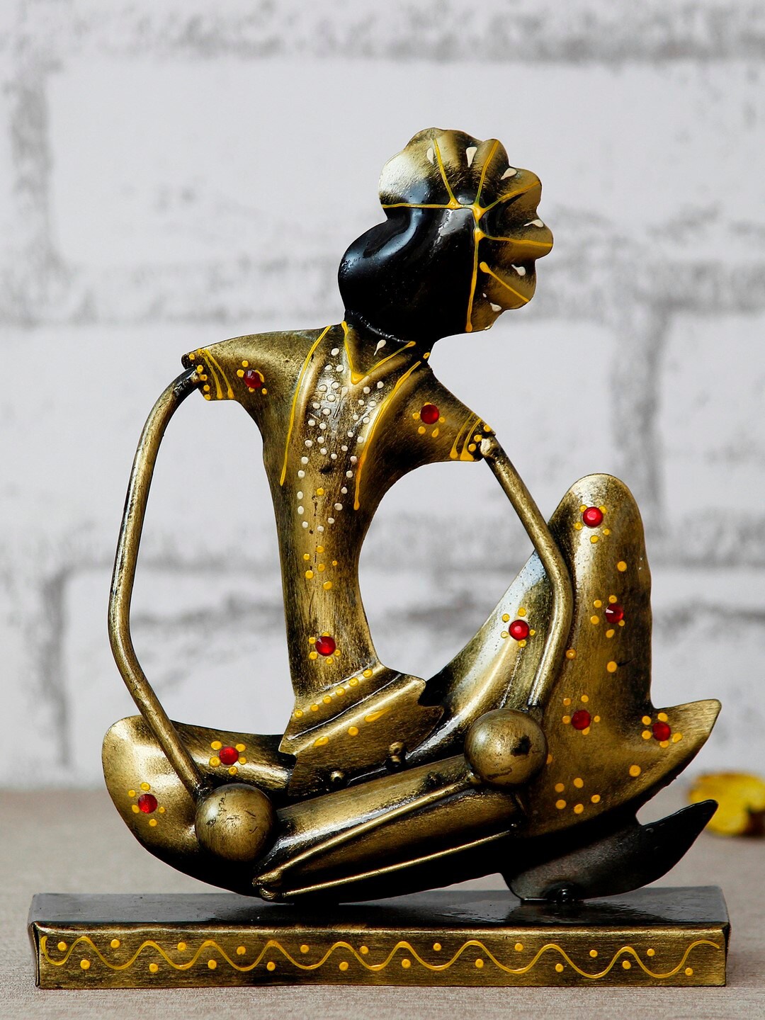 eCraftIndia Gold-Toned & Black Tribal Man with Pagdhi Playing Musical Instrument Dholak Decorative Showpiece
eCraftIndia Gold-Toned & Black Tribal Man with Pagdhi Playing Musical Instrument Dholak Decorative Showpiece